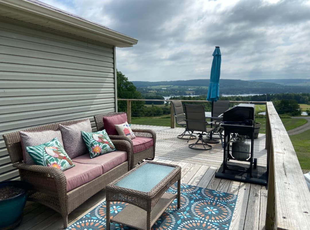 Furnished deck with grill and countryside views