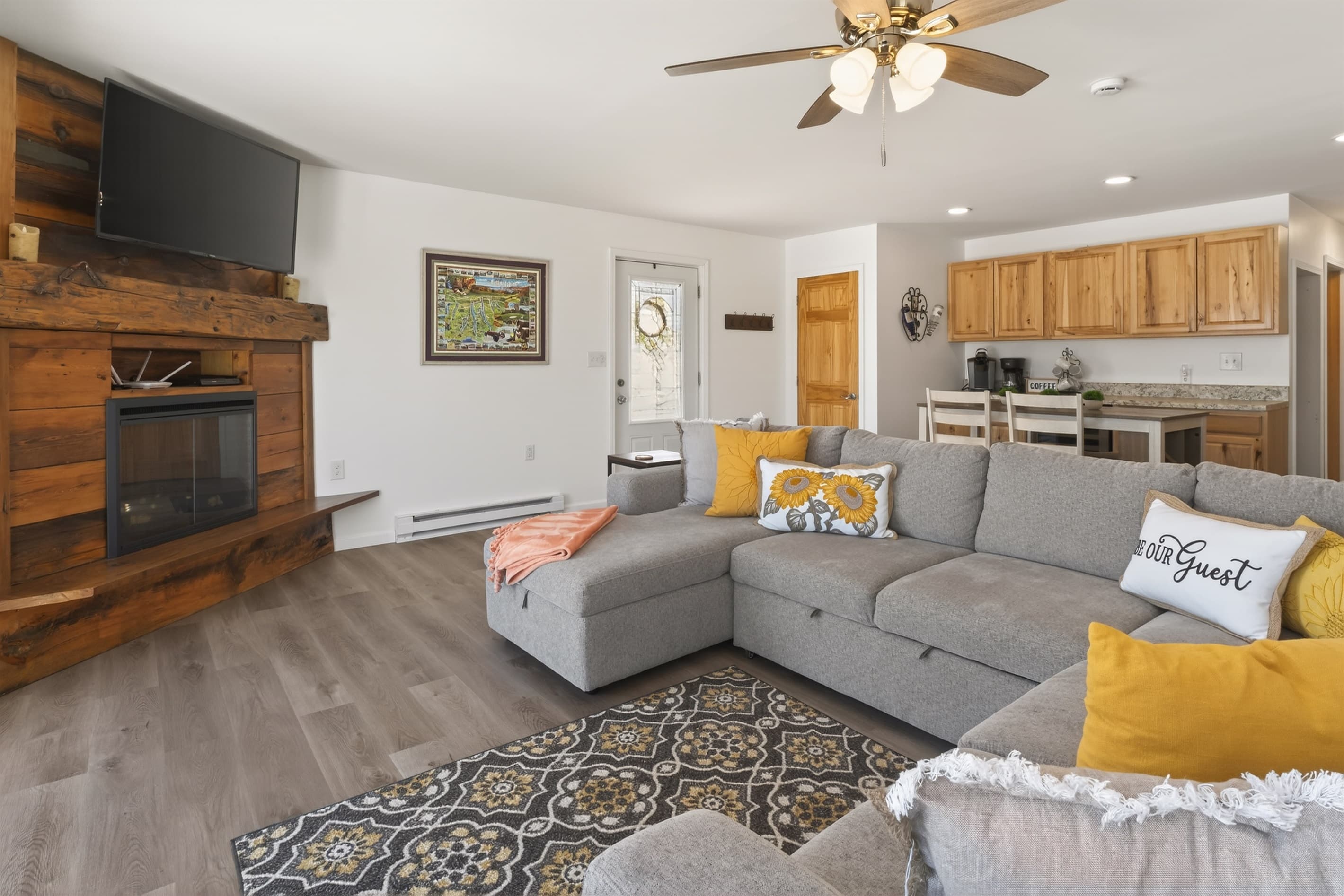Wooden fireplace beside seating area