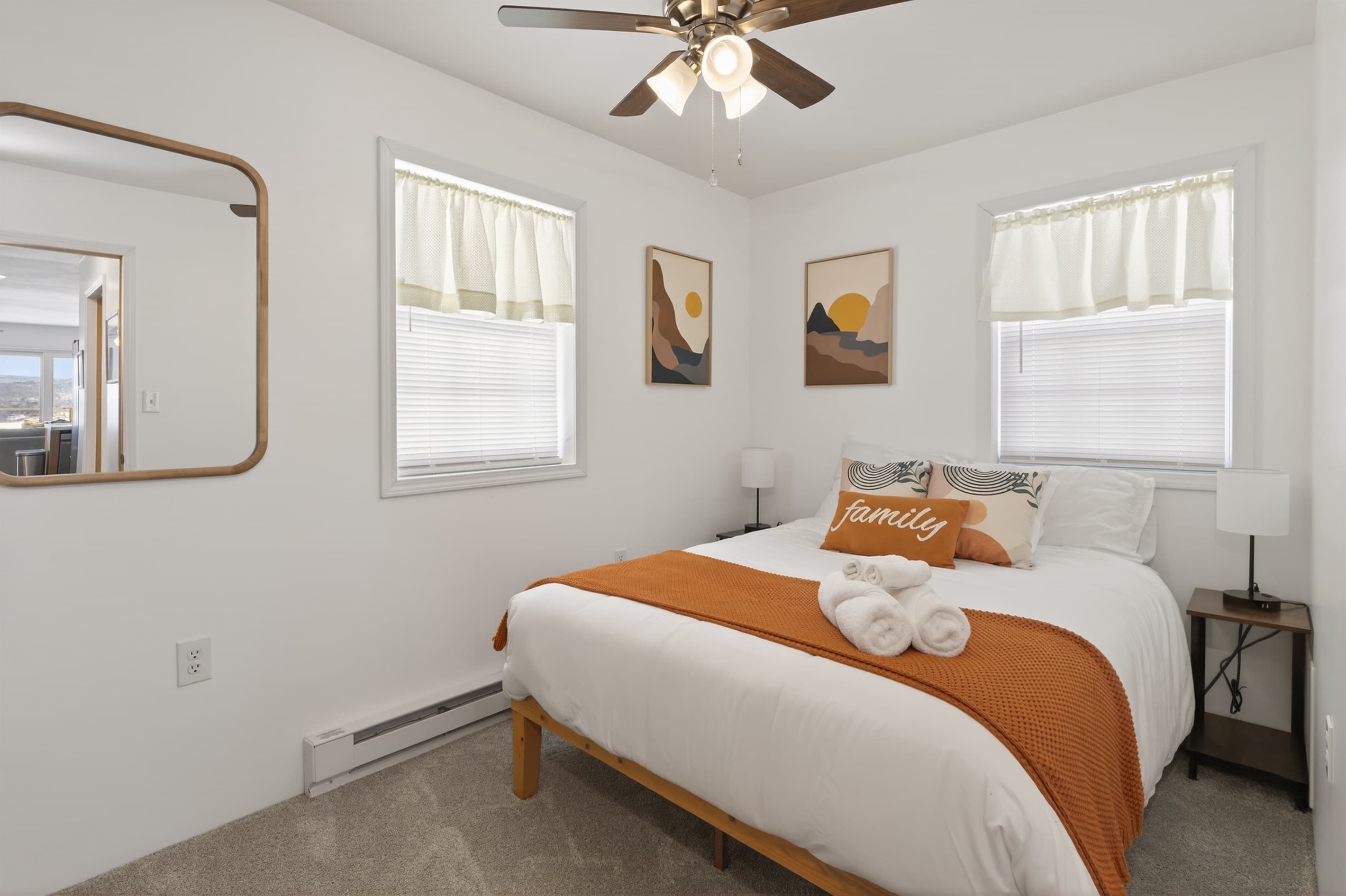 Bedroom with orange runner and bedside tables
