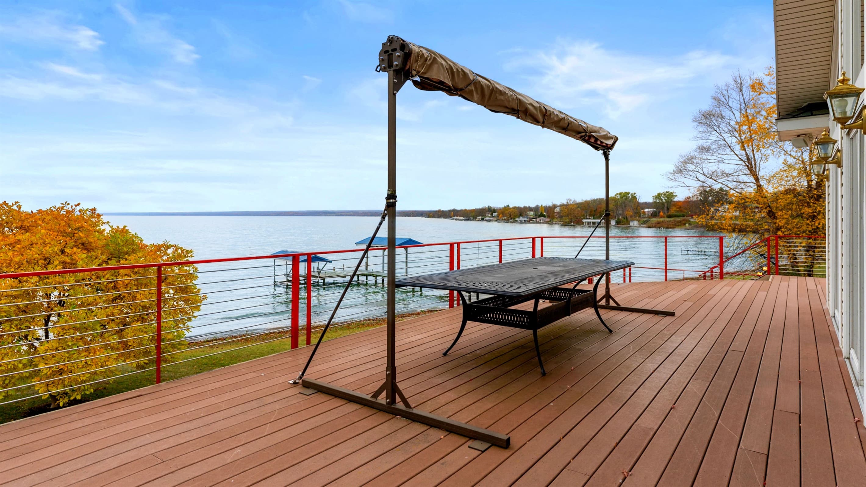 Large outdoor table for alfresco dining with sun shade for convenience