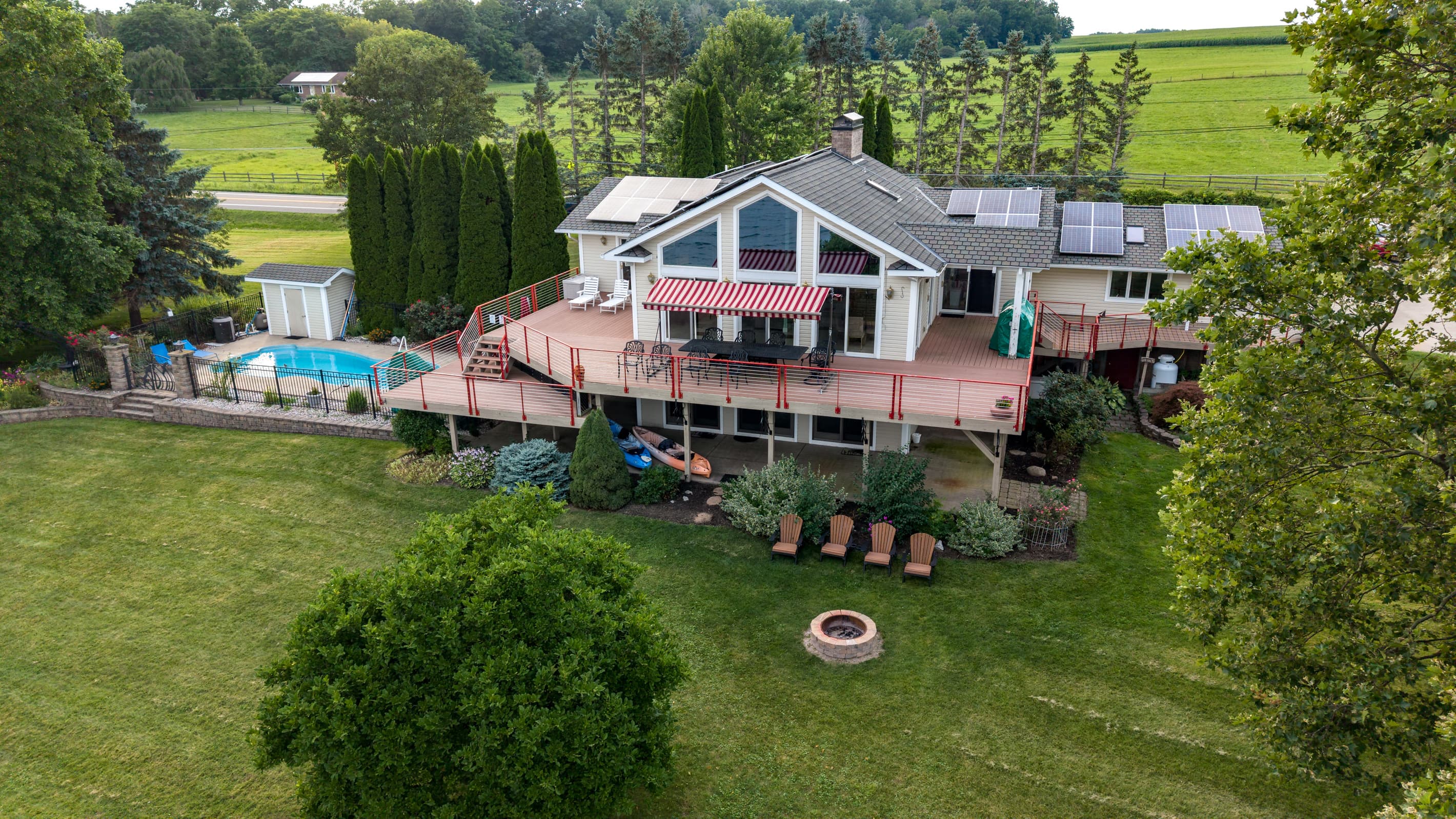 Lake-facing exterior with fire pit and deck