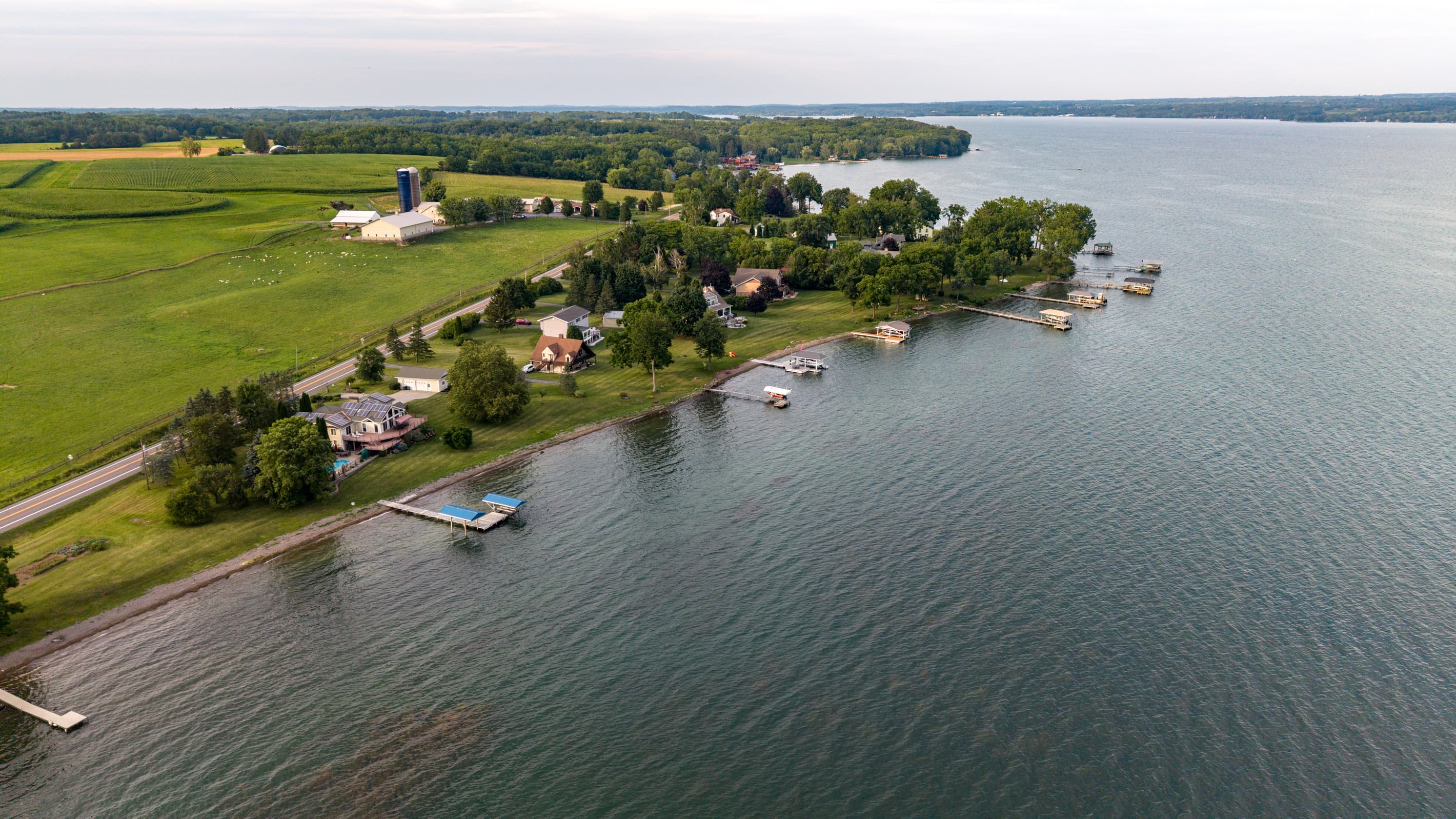 Shoreline homes with fields stretching inland