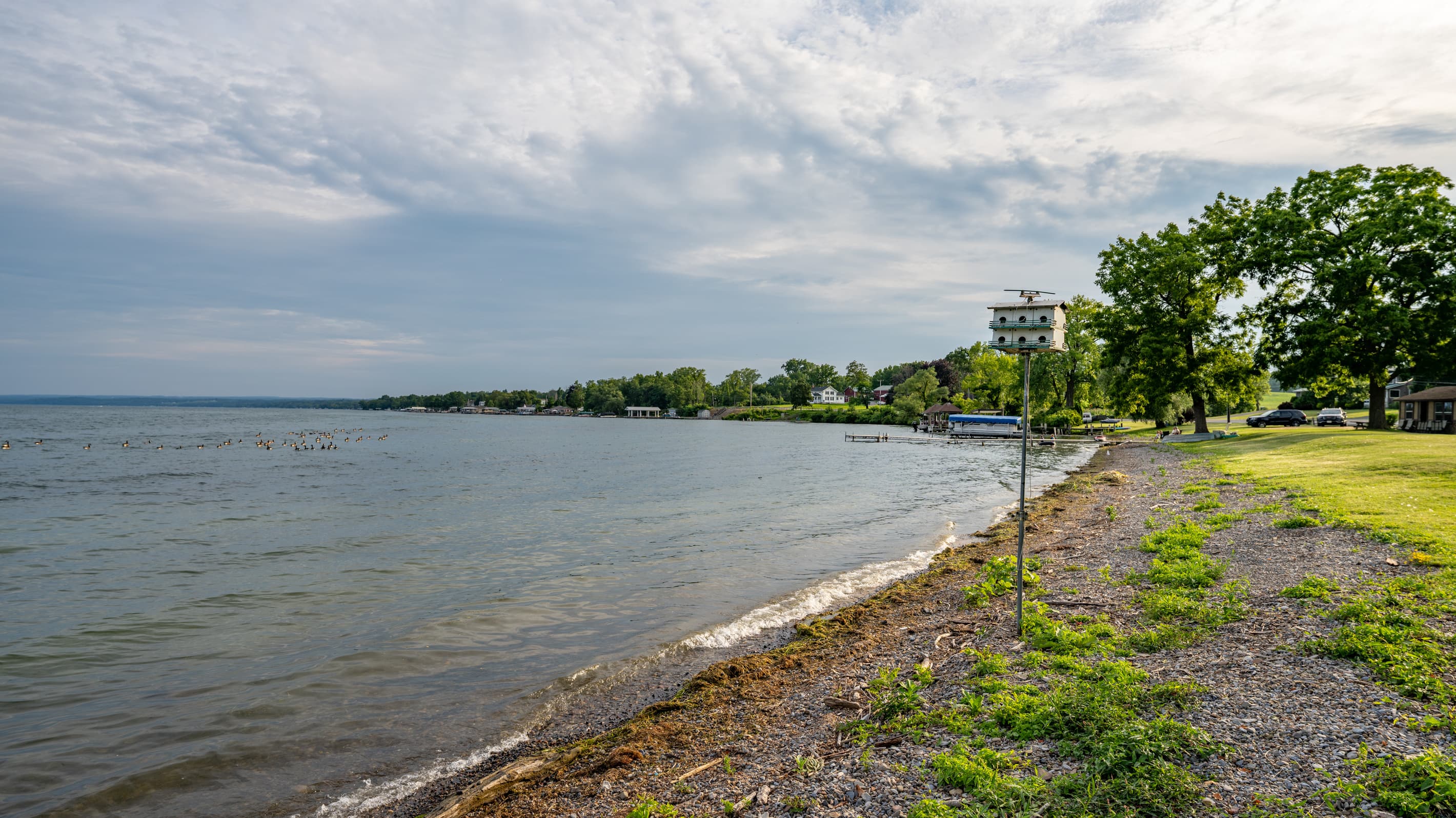 Rocky shoreline beneath overcast skies