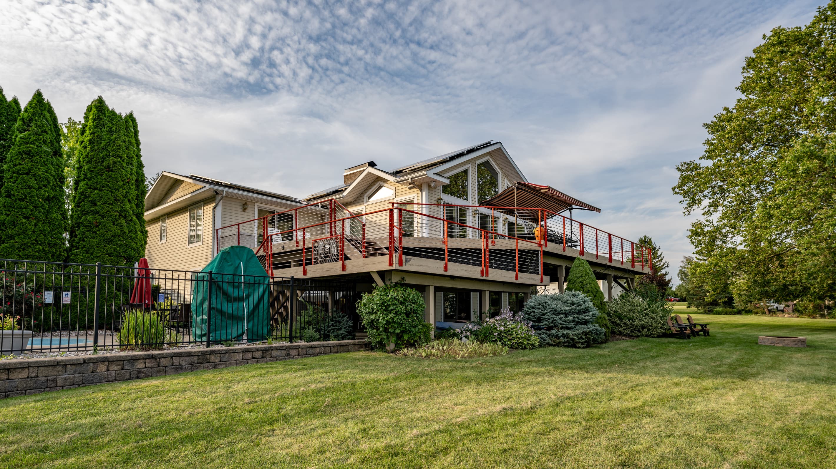 Raised wraparound deck above the side yard