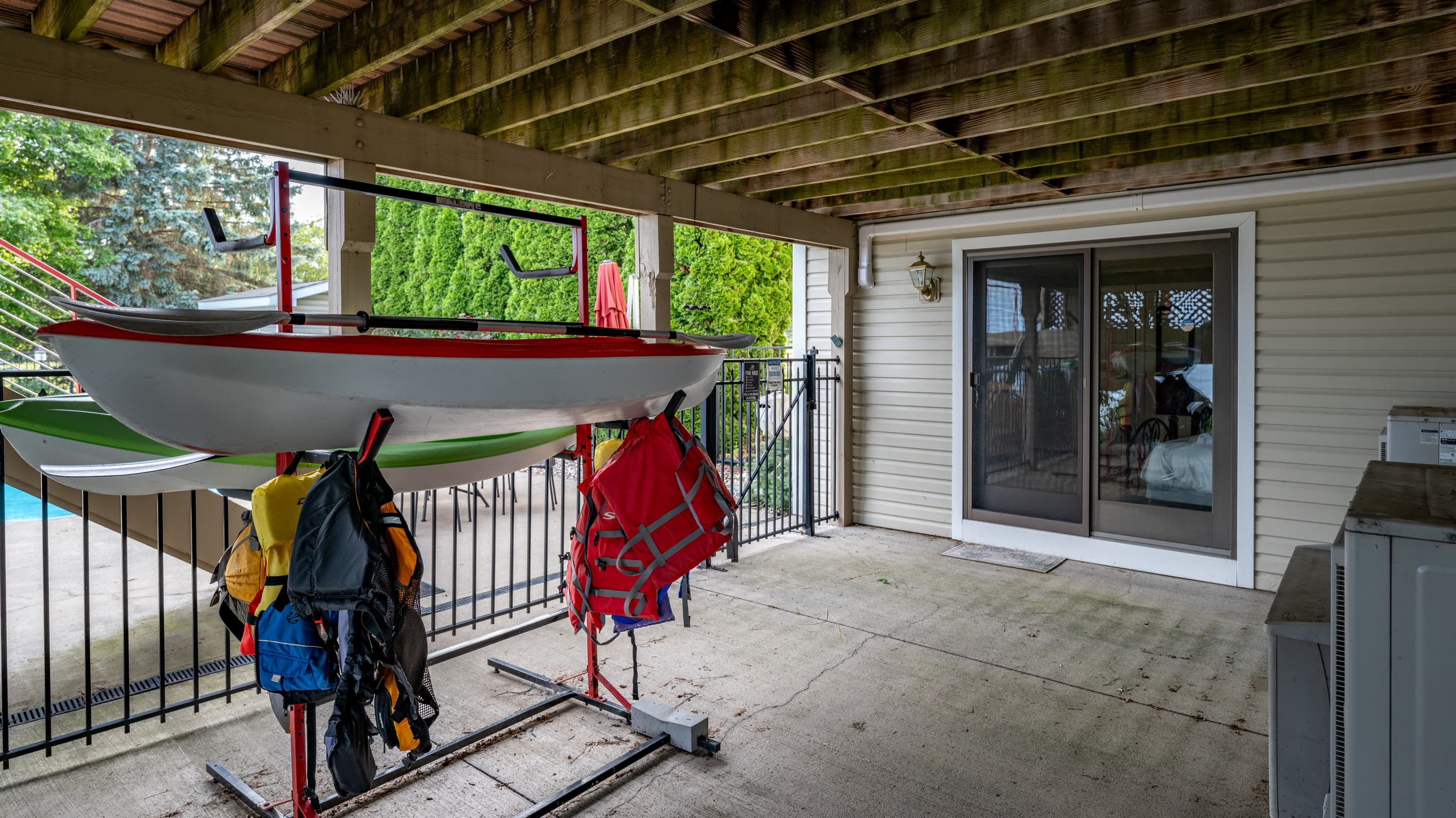 Kayak storage rack beneath the upper deck