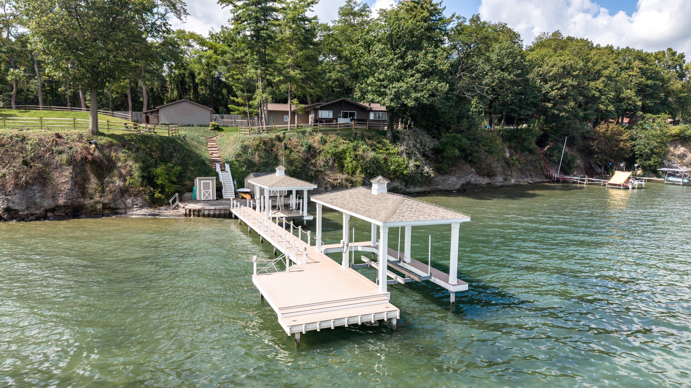 Private dock with covered boat lift
