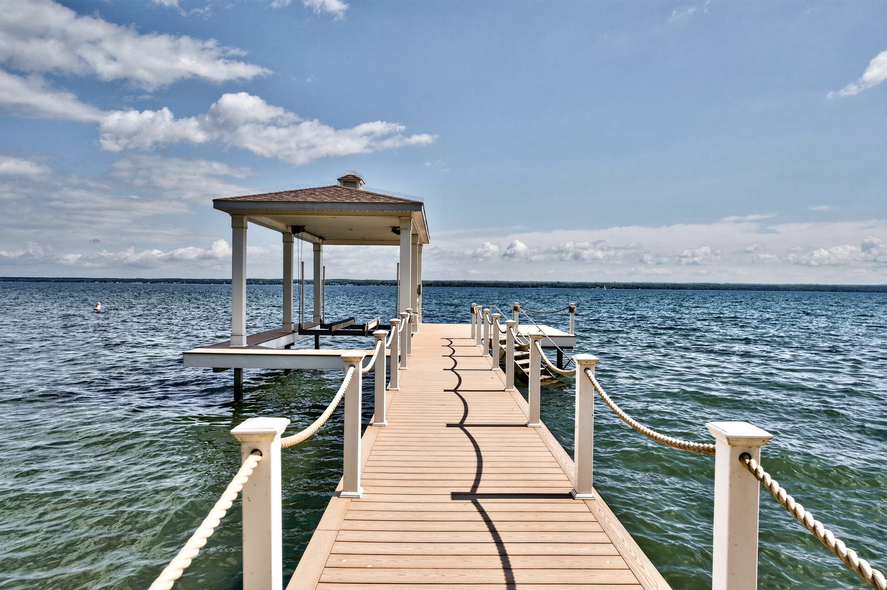 Covered dock extending into the water