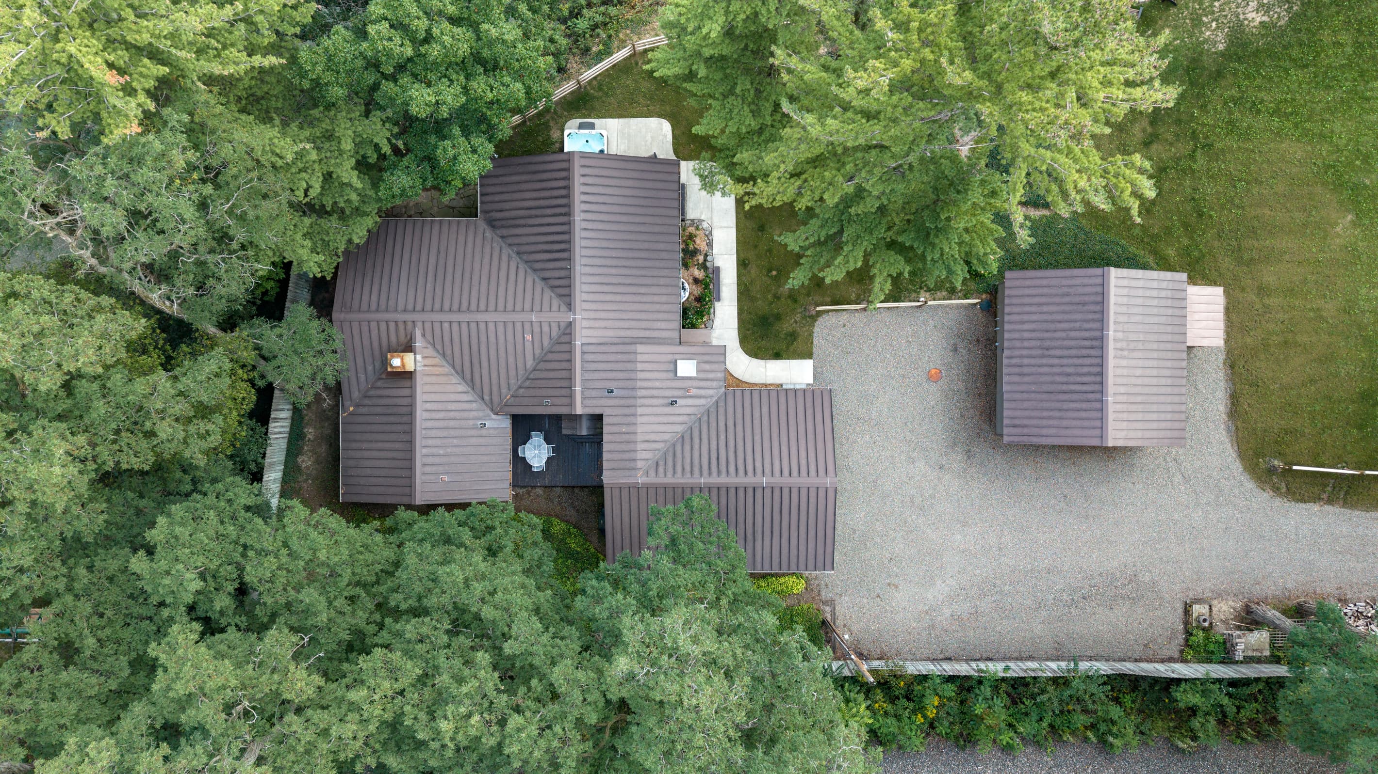 Aerial view of the wooded home