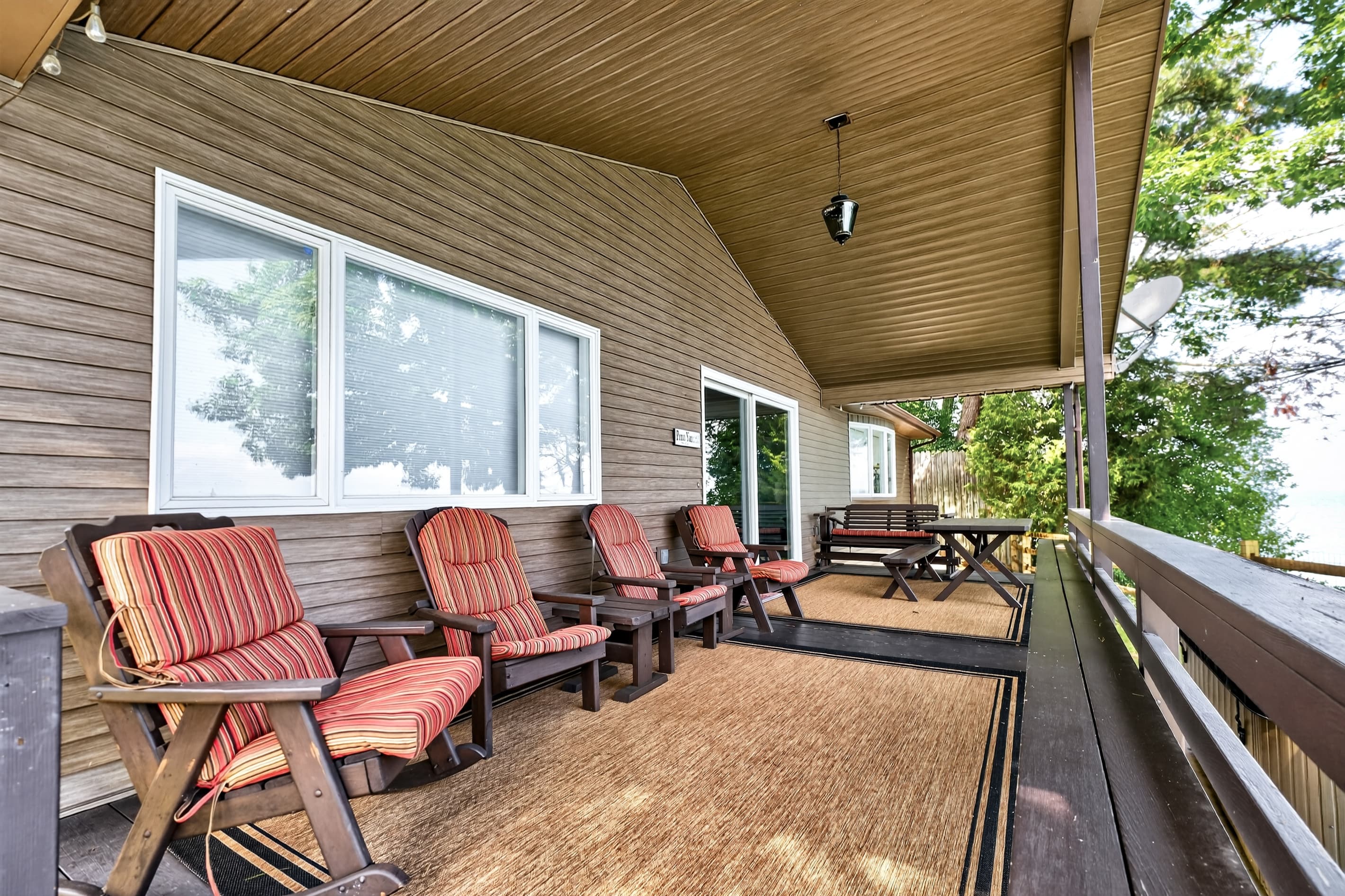 Covered porch with lakefront seating