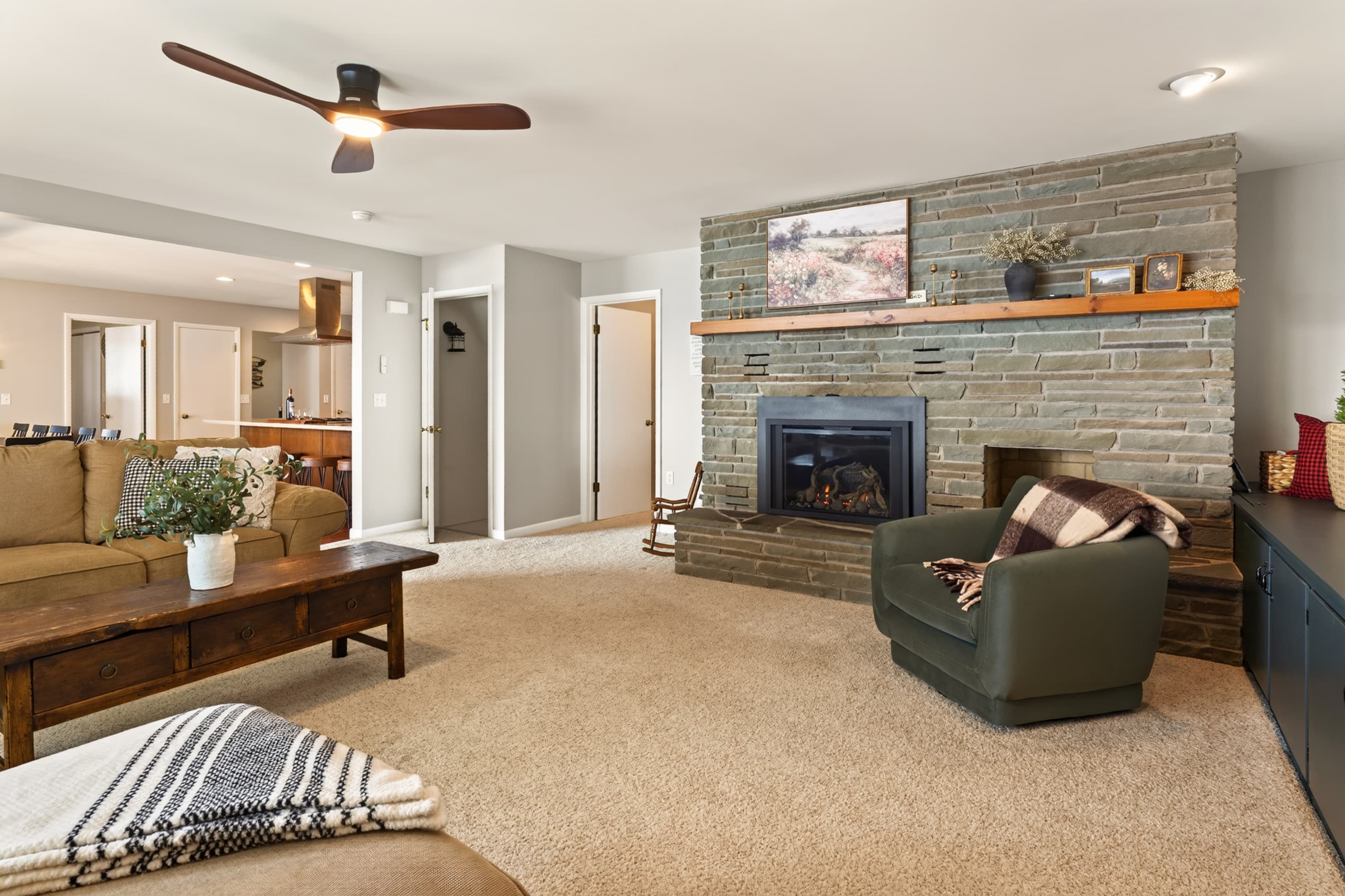Living room with stone fireplace