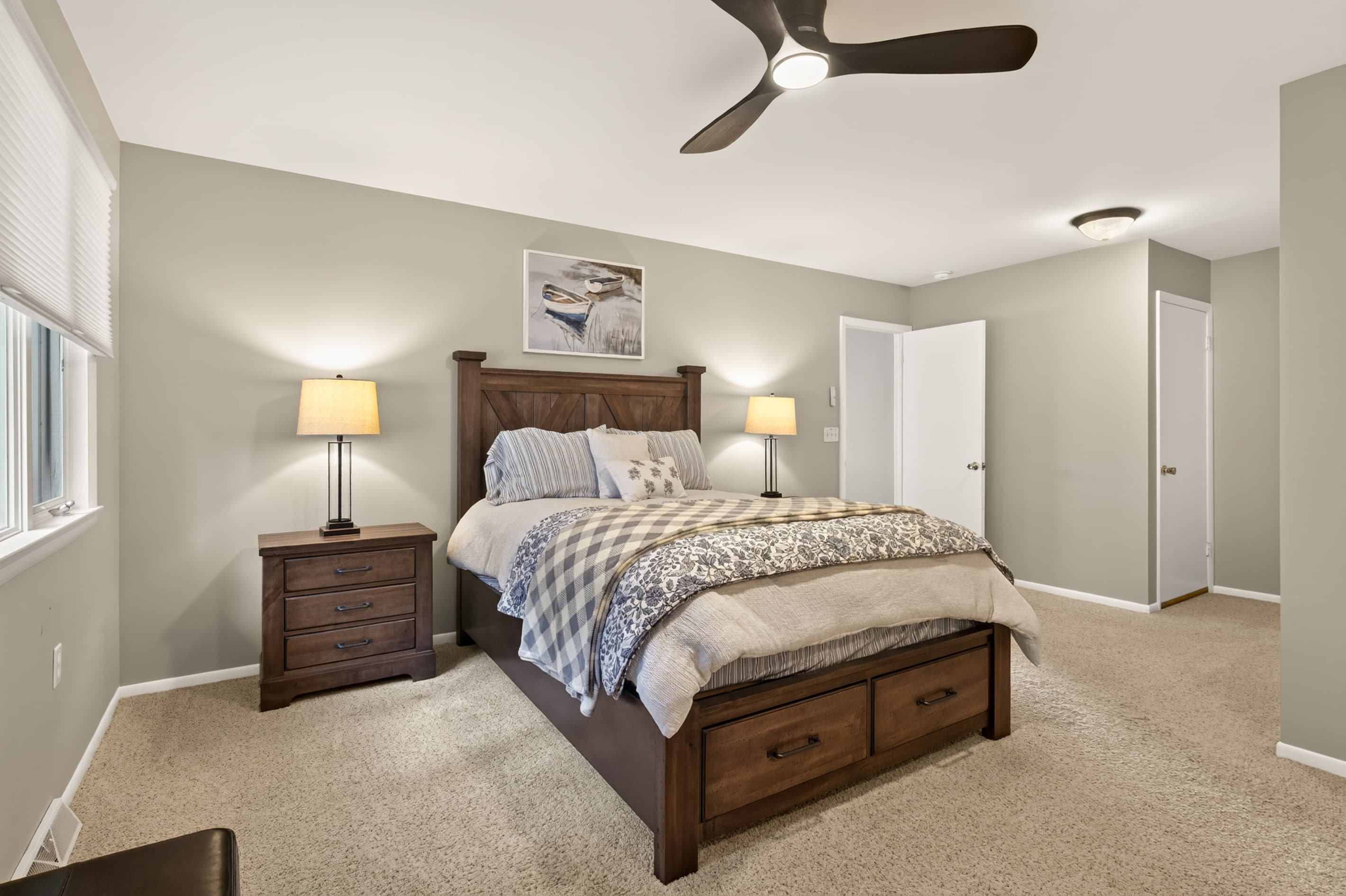 King bedroom with dresser and bench