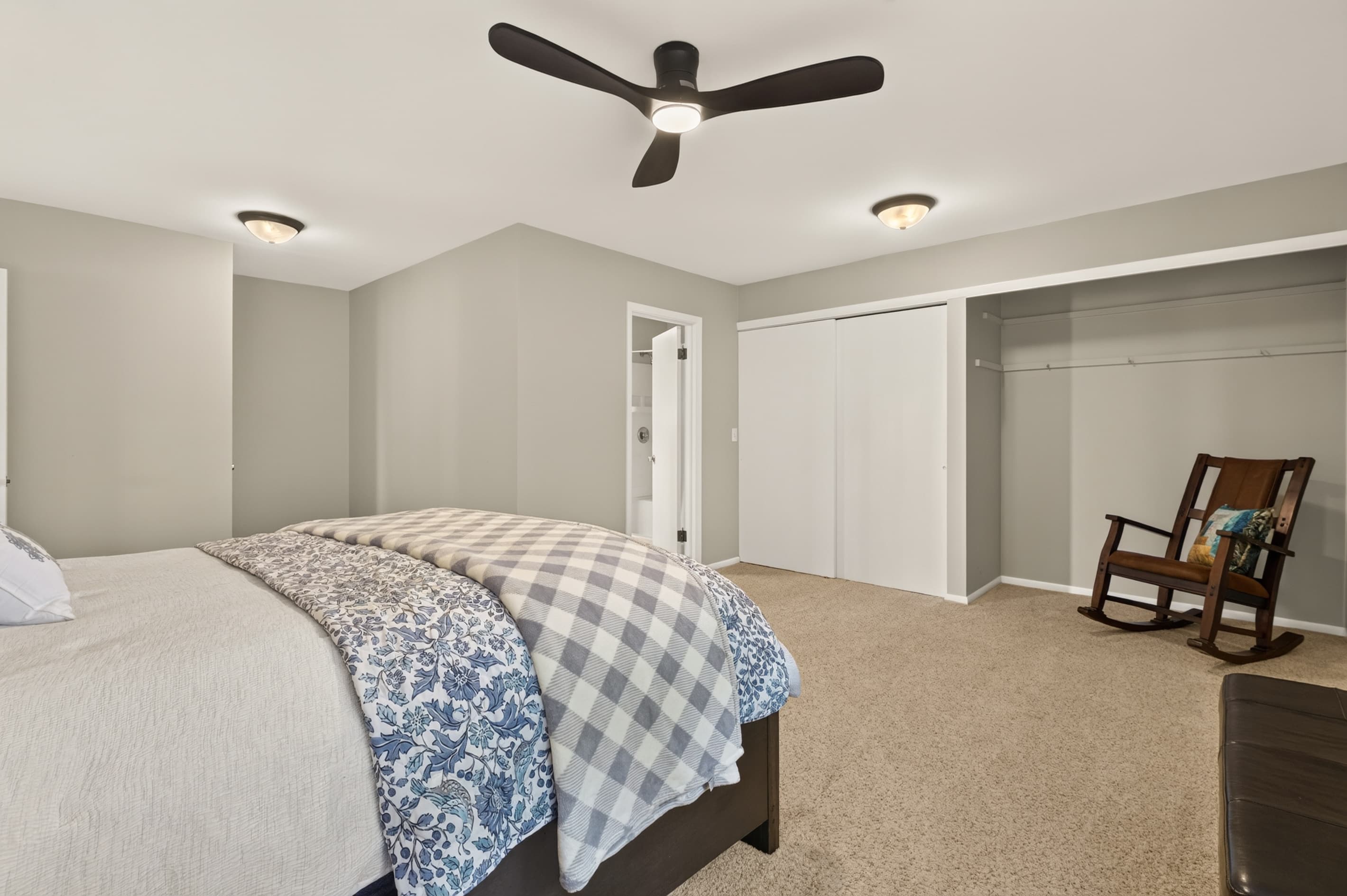 Spacious bedroom with rocking chair