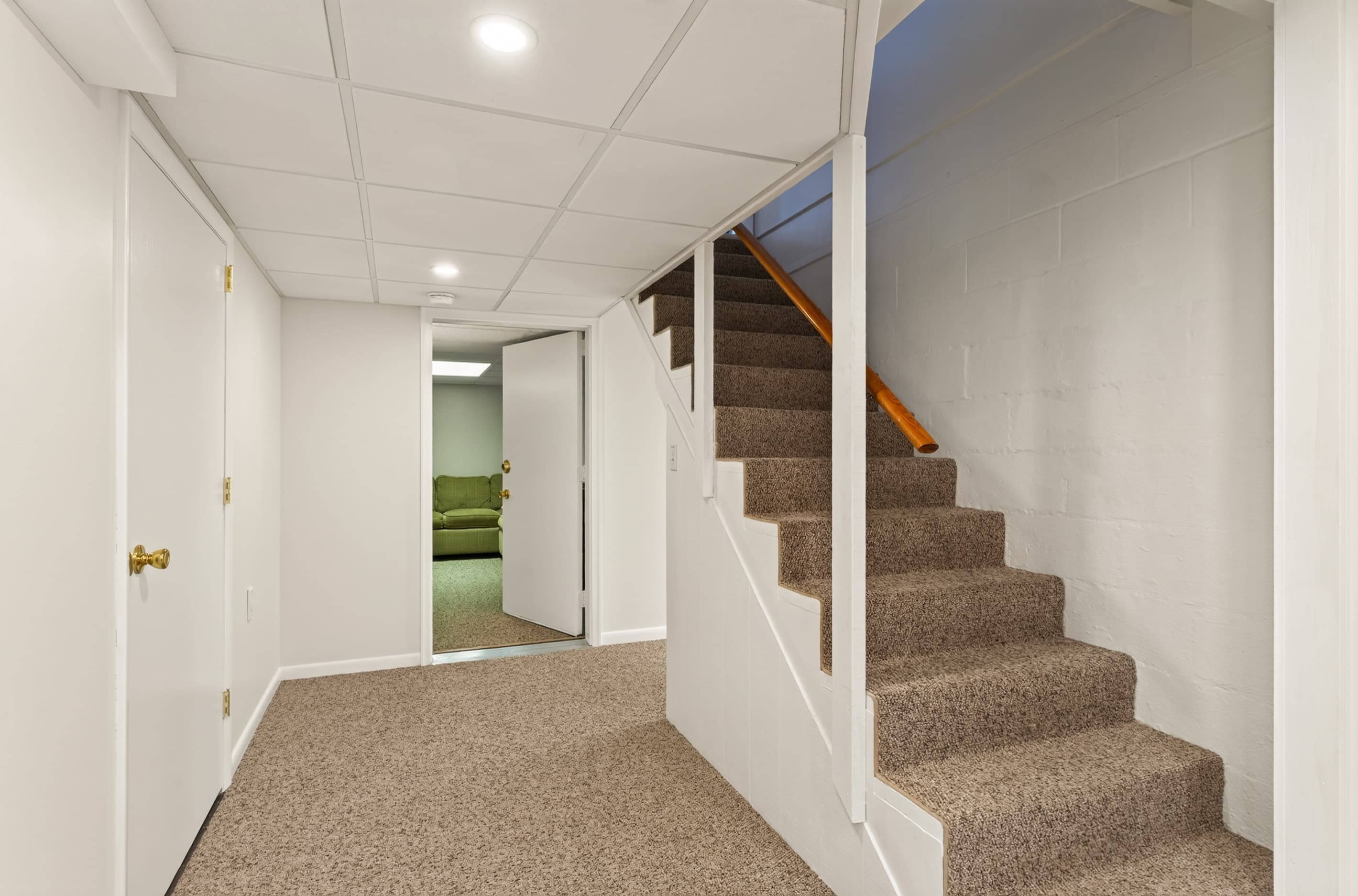 Lower-level hallway beside the staircase
