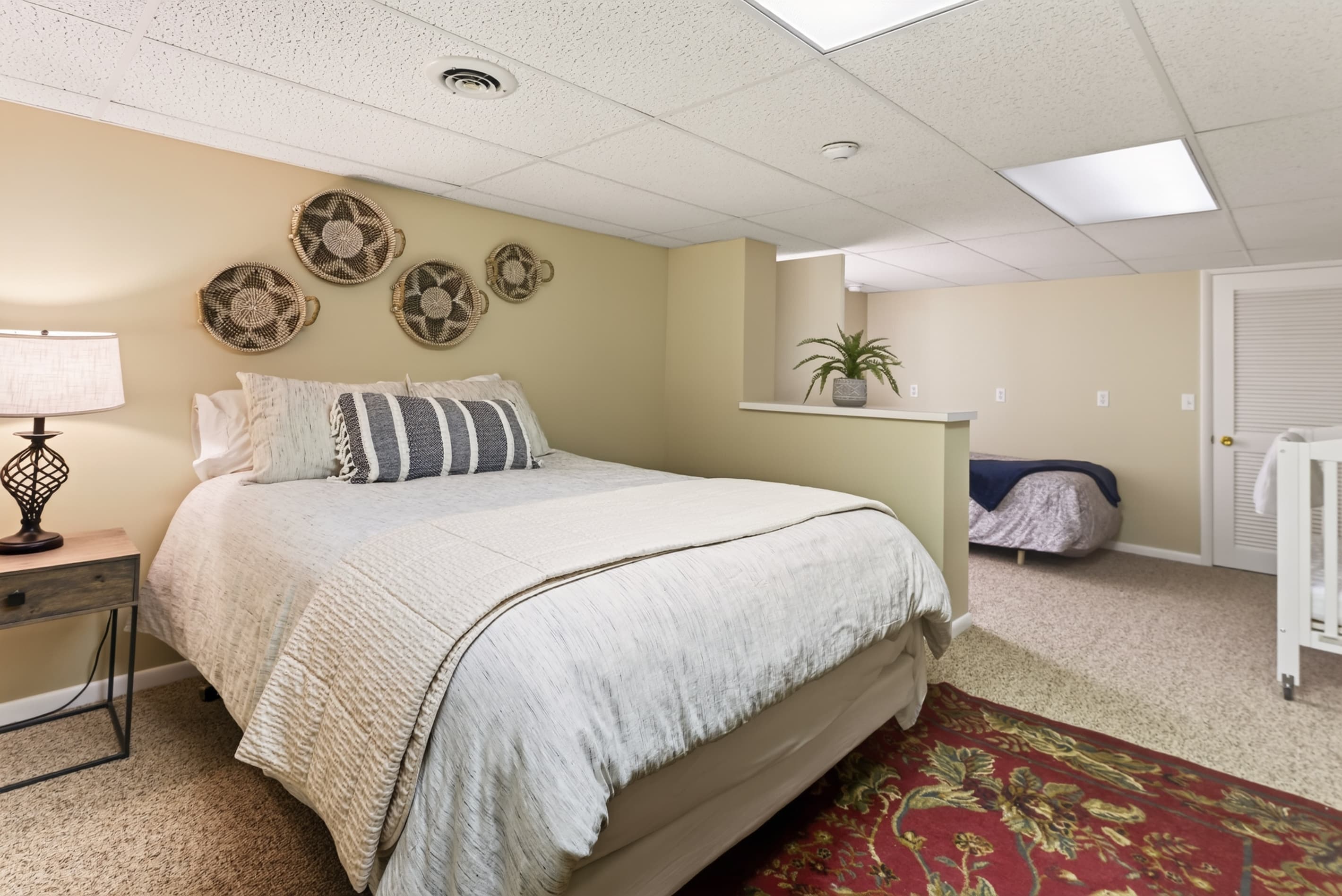 Queen bedroom with adjoining sleeping area