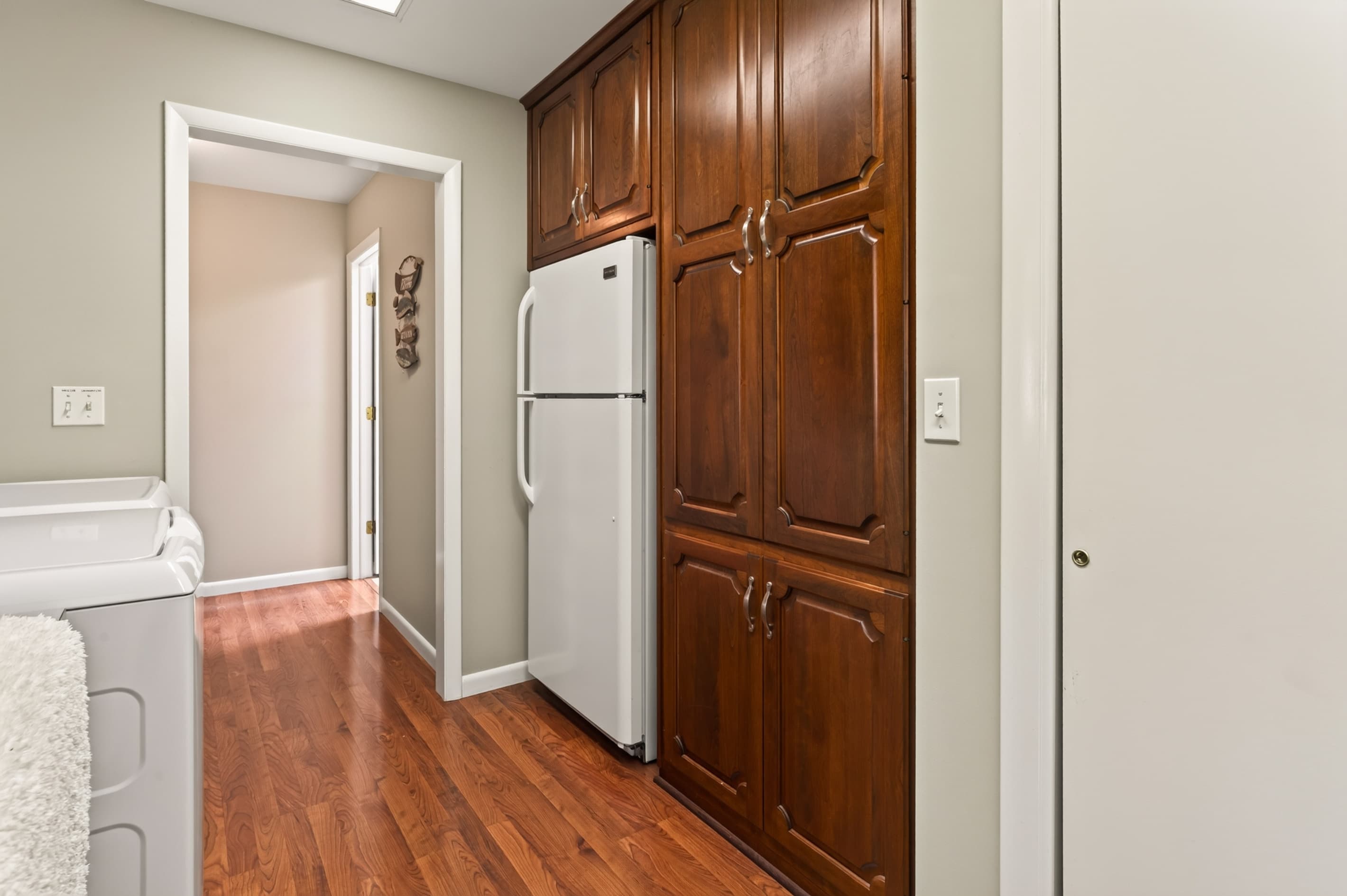 Hallway with built-in wood cabinetry