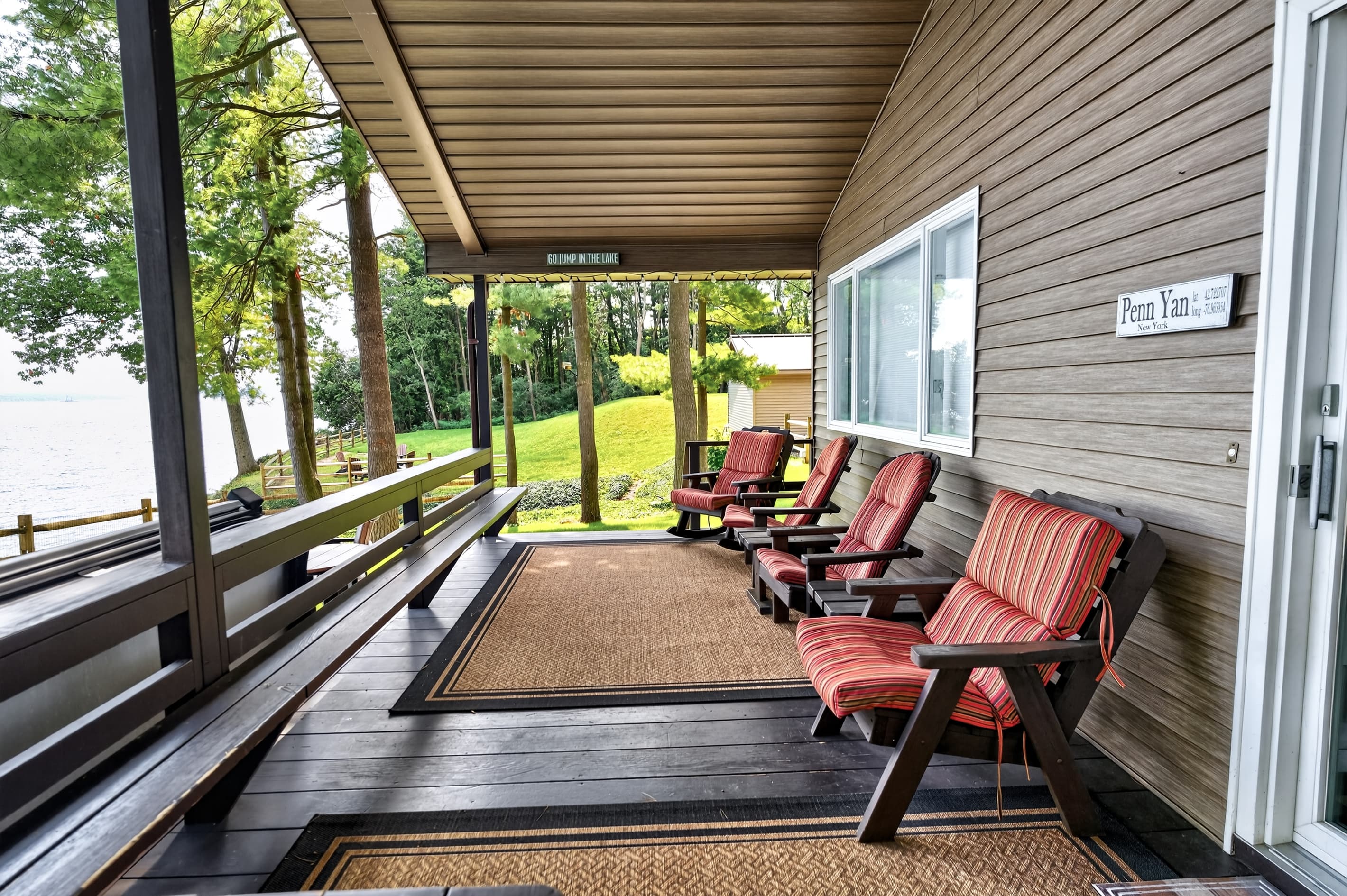 Covered porch with Adirondack chairs