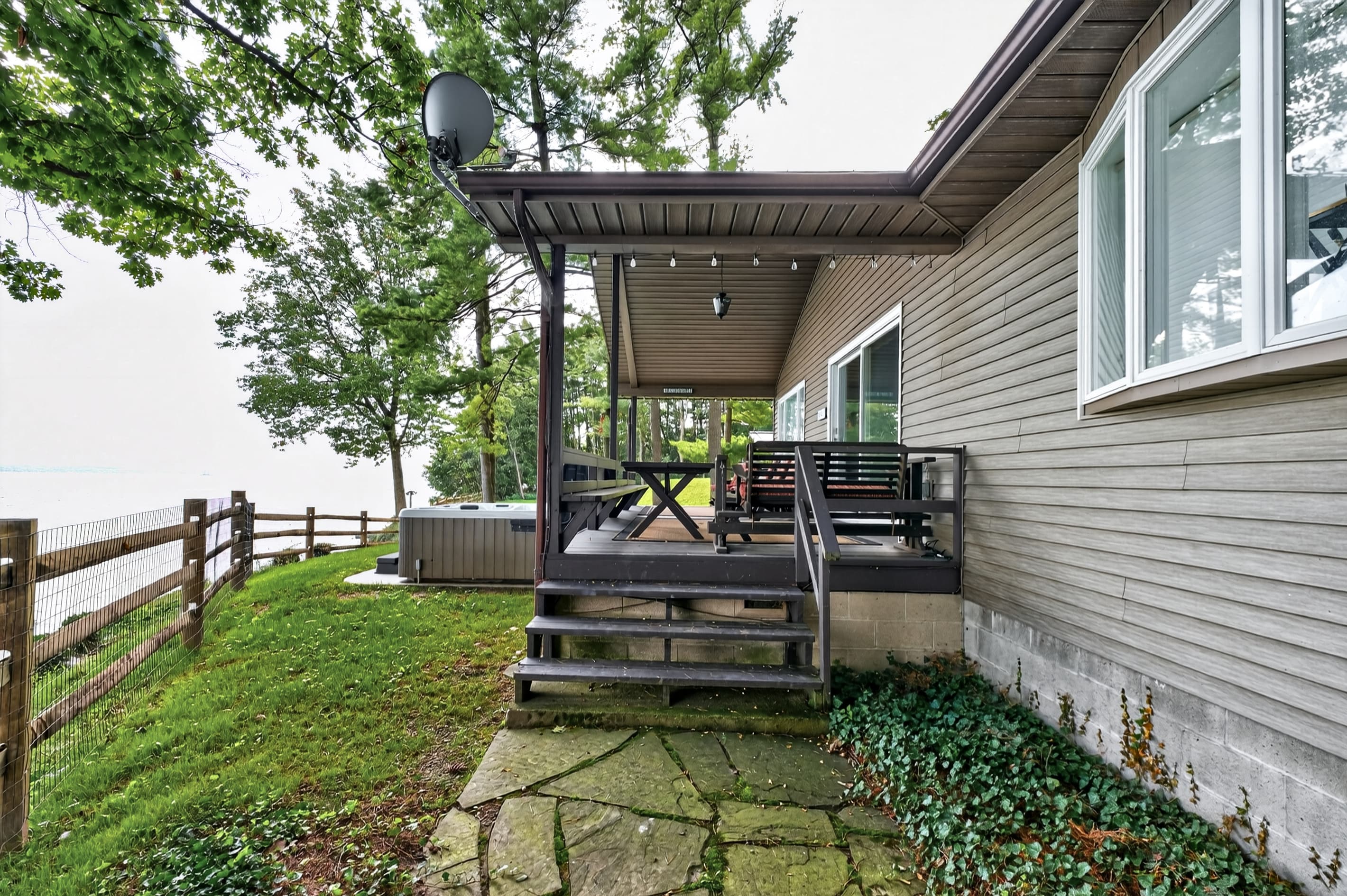 Covered side porch above the shoreline