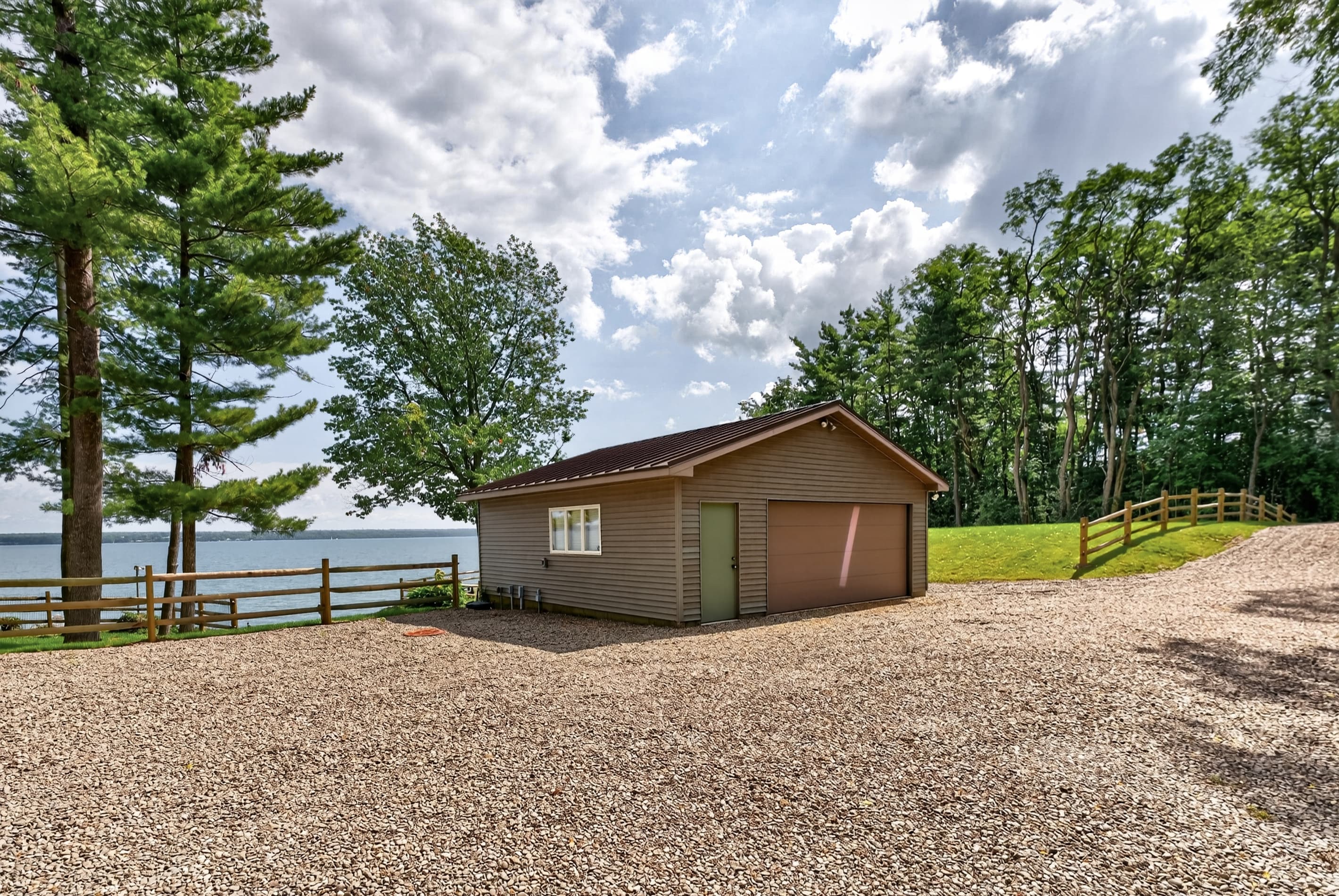 Gravel driveway with detached garage