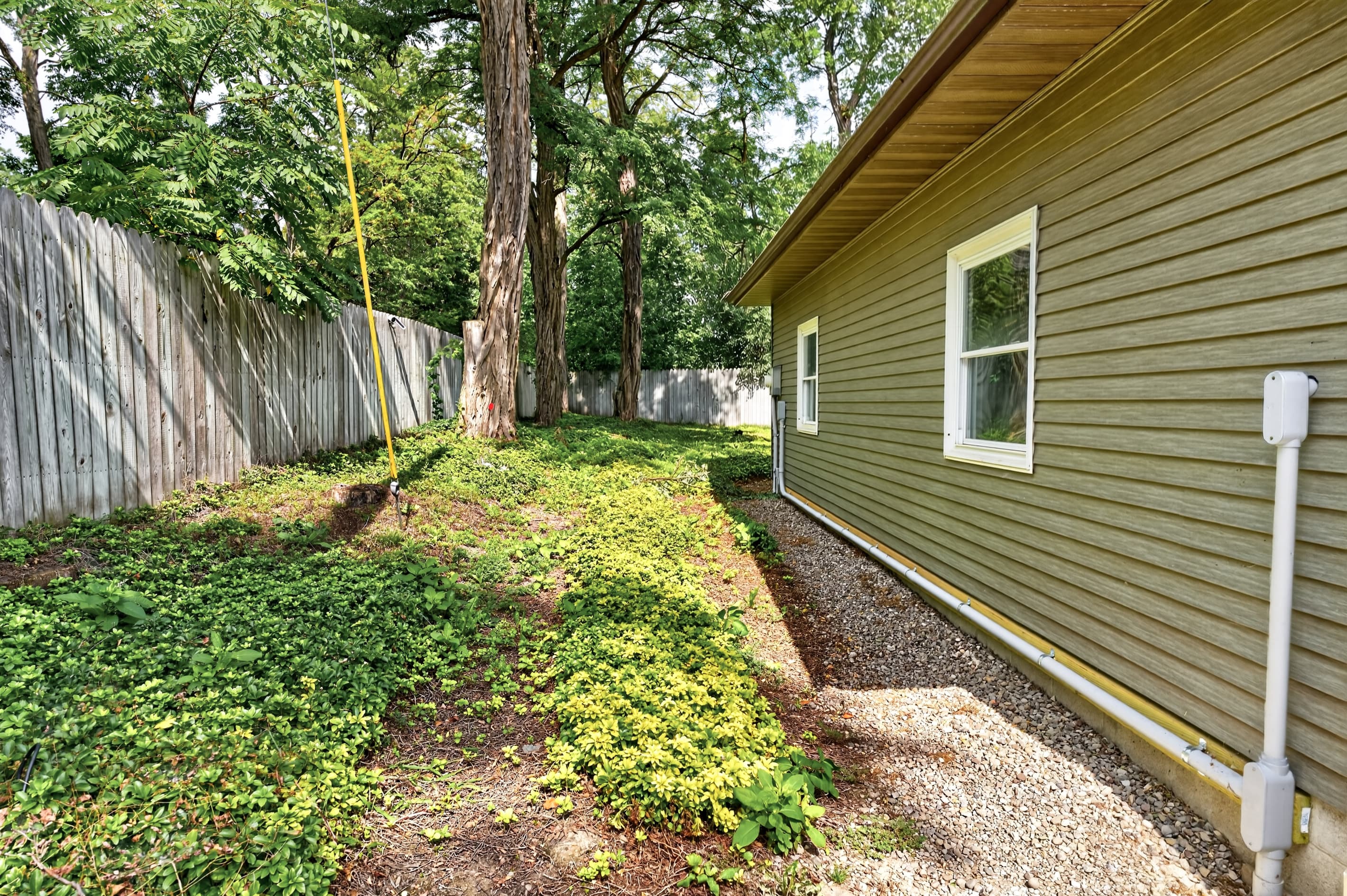 Side yard with wooded pathway