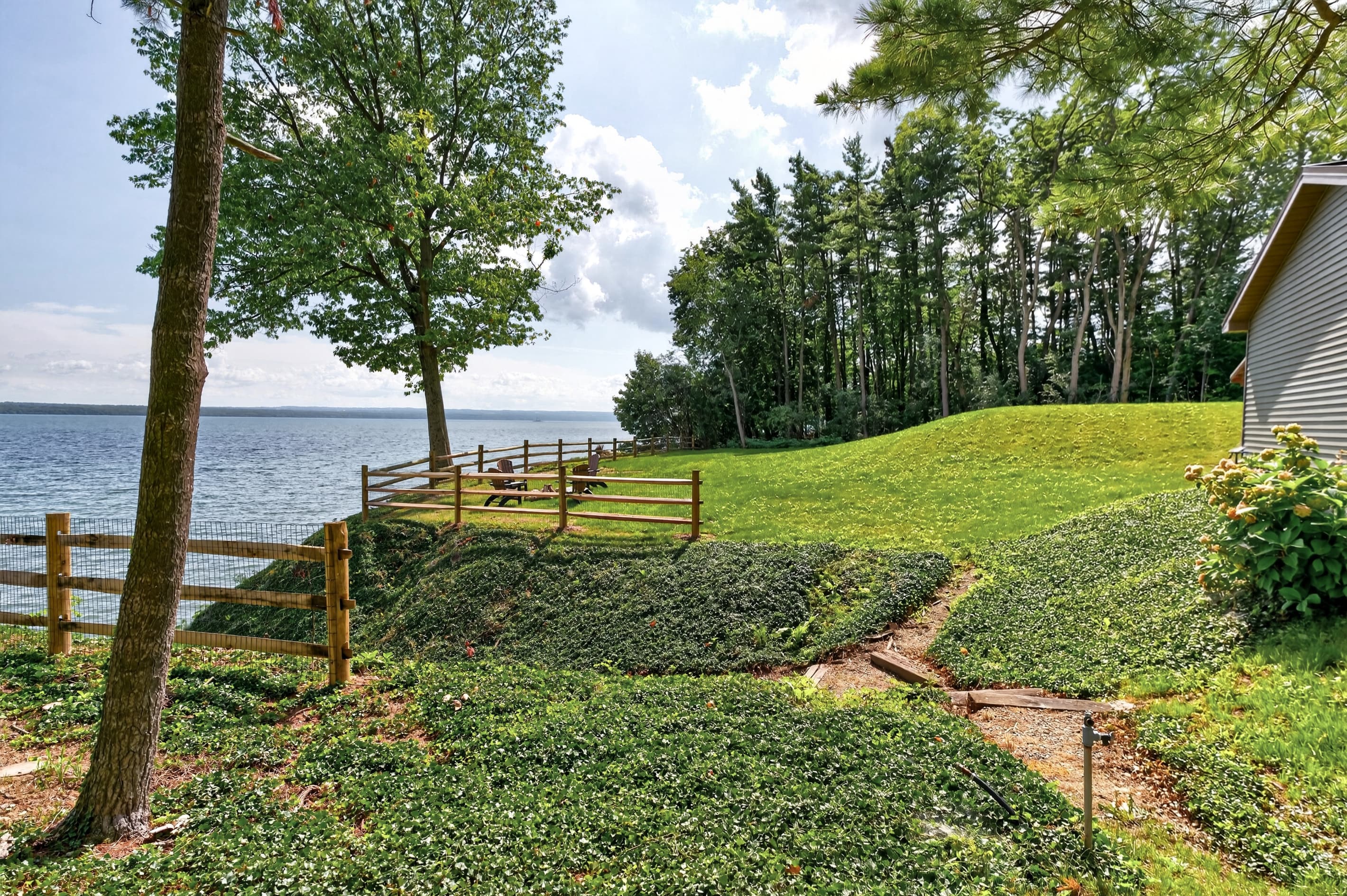 Grassy shoreline above the dock stairs