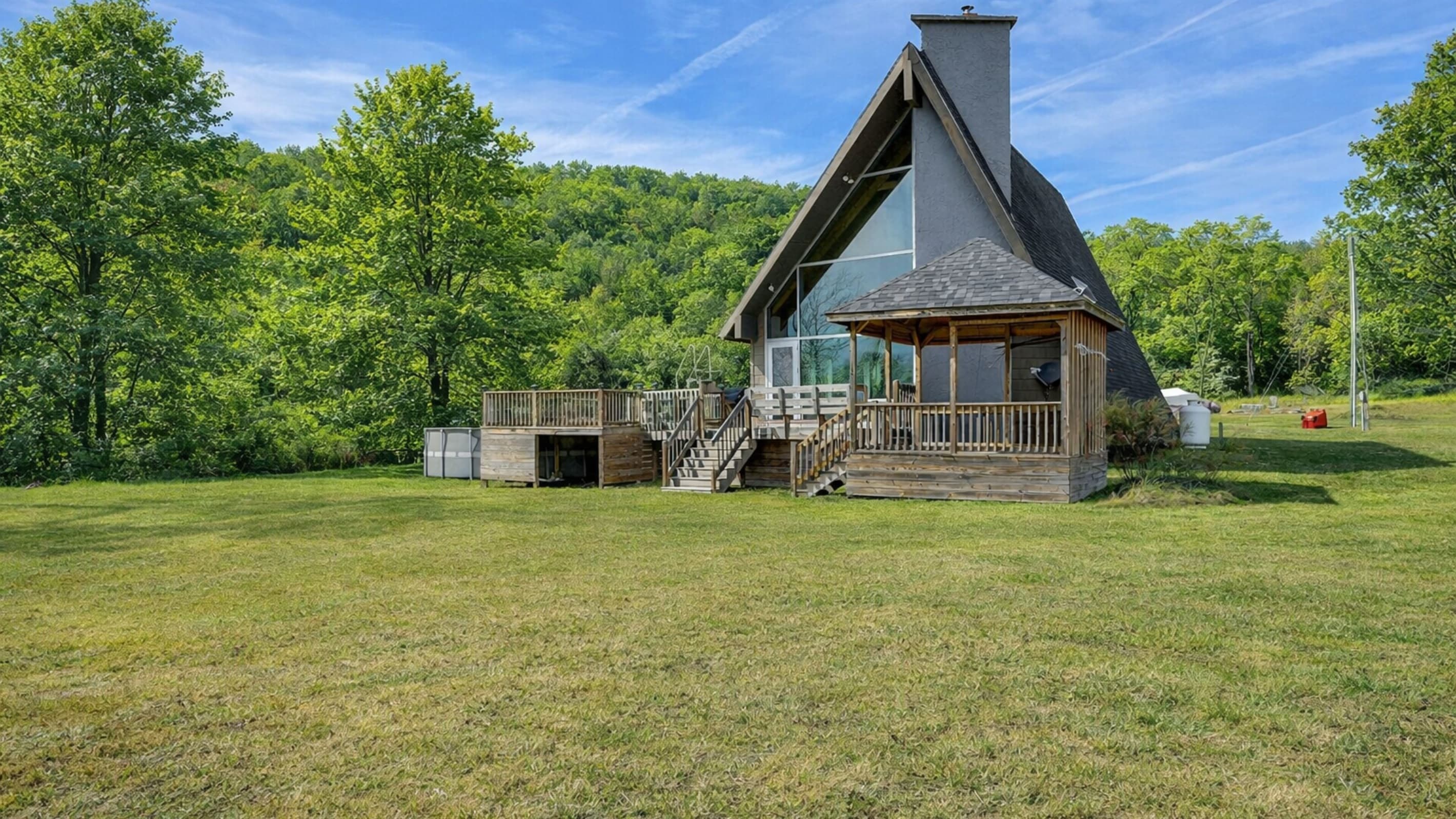 A-frame home with expansive front lawn