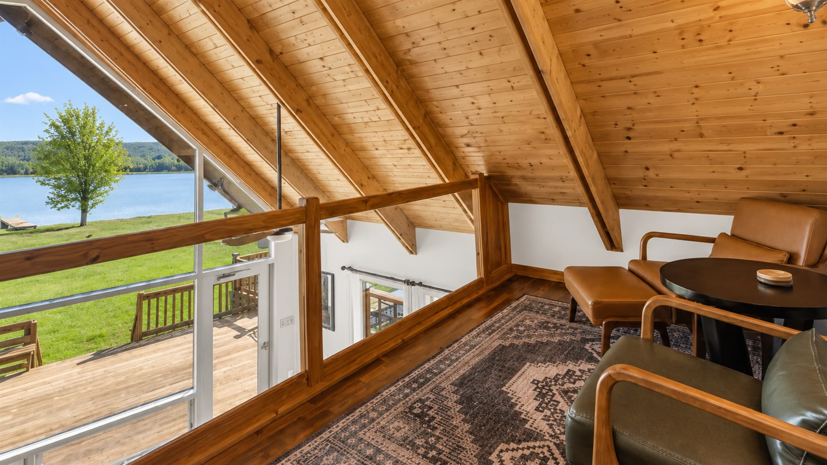 Sunroom seating beneath exposed wood beams