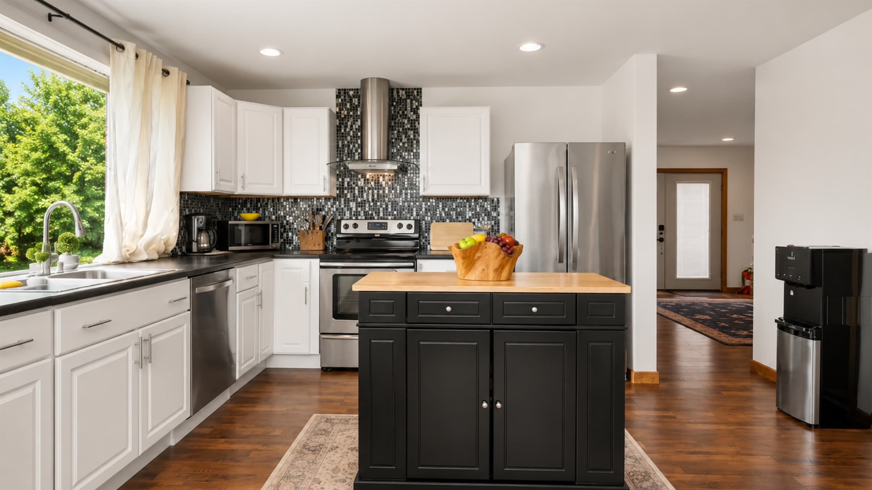 Gas range framed by bright kitchen windows