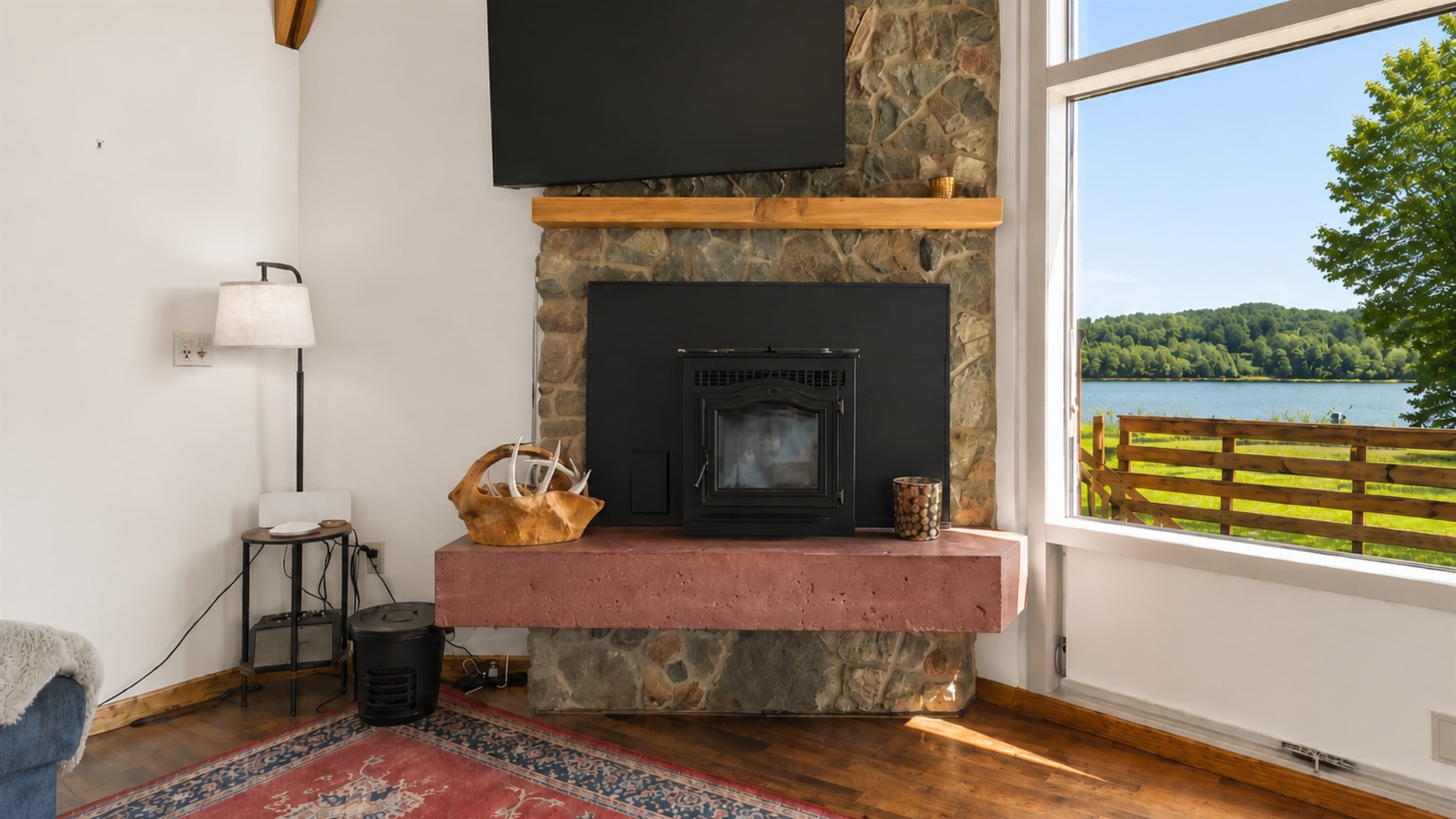 Fireplace and television facing the lake