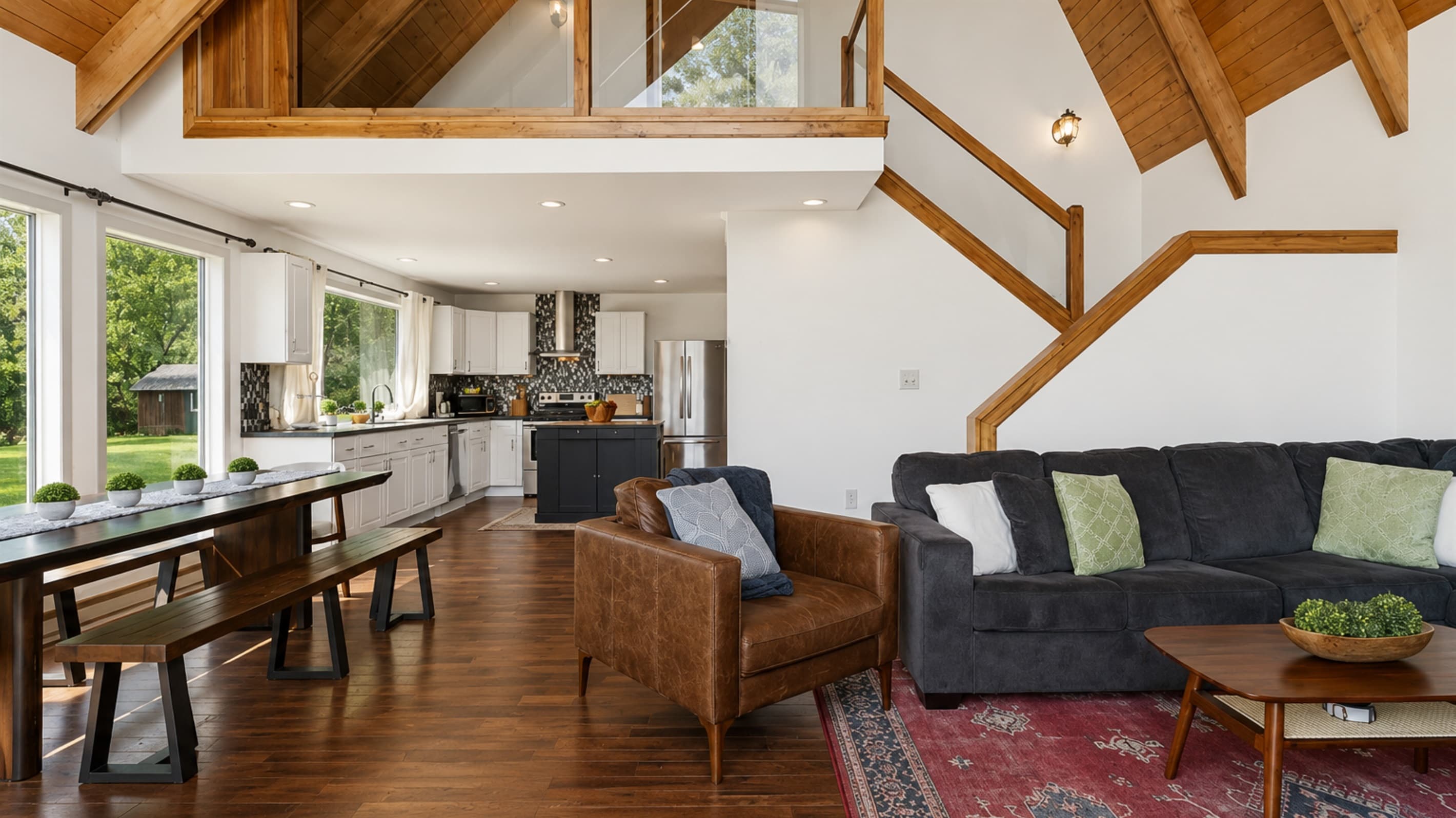 Living and dining areas beneath vaulted ceilings