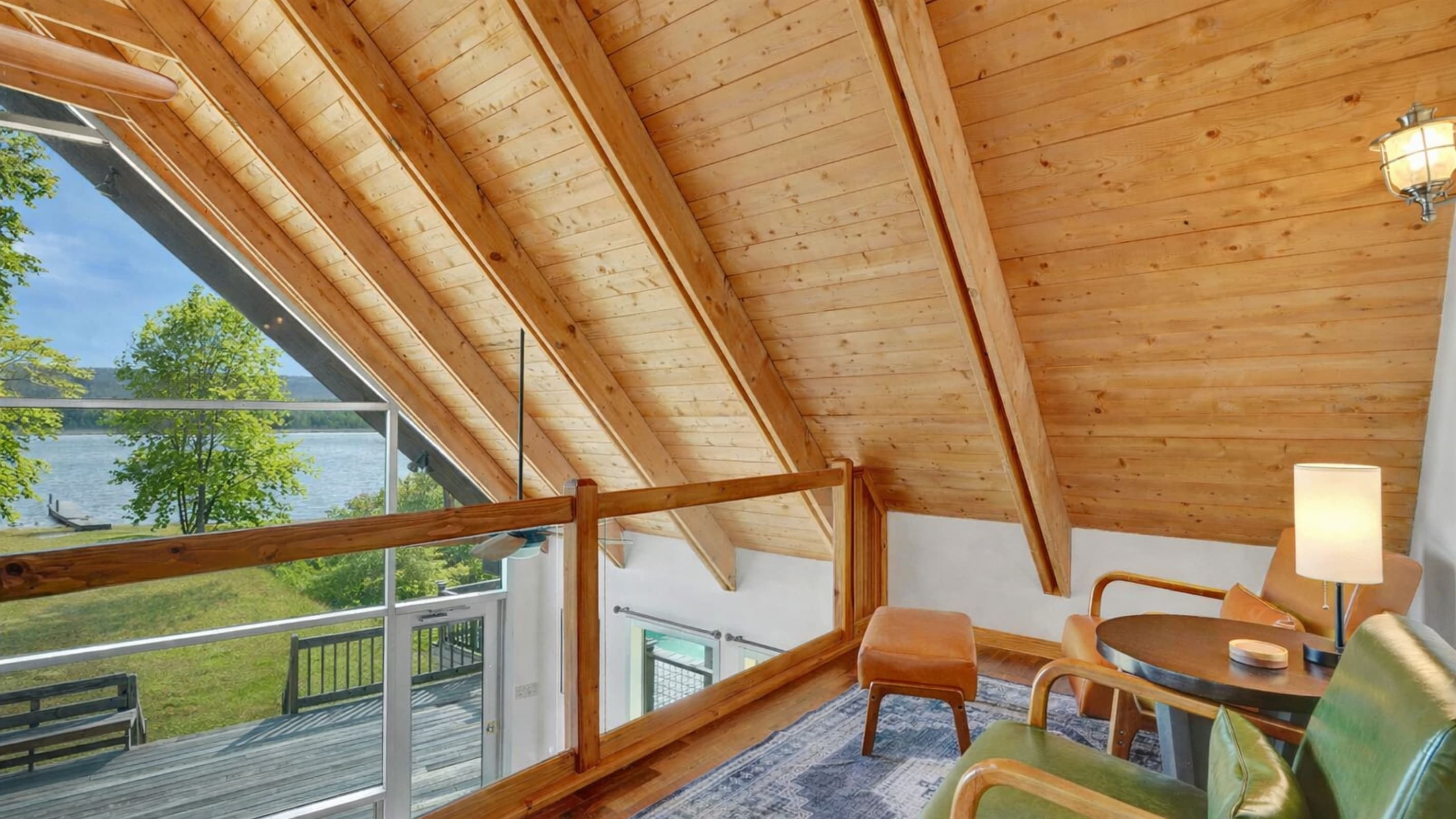 Wood-paneled sunroom with outdoor views
