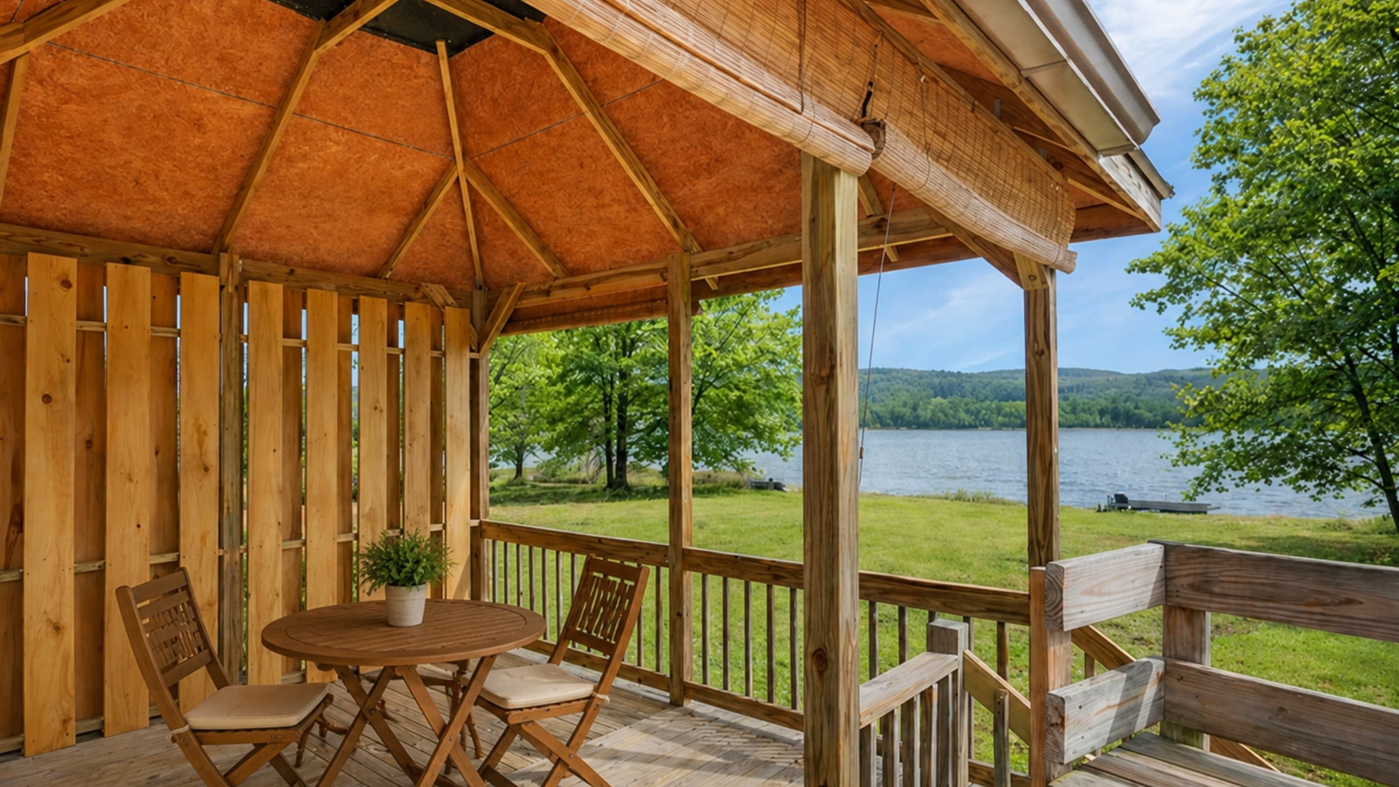 Covered outdoor dining area facing the lake