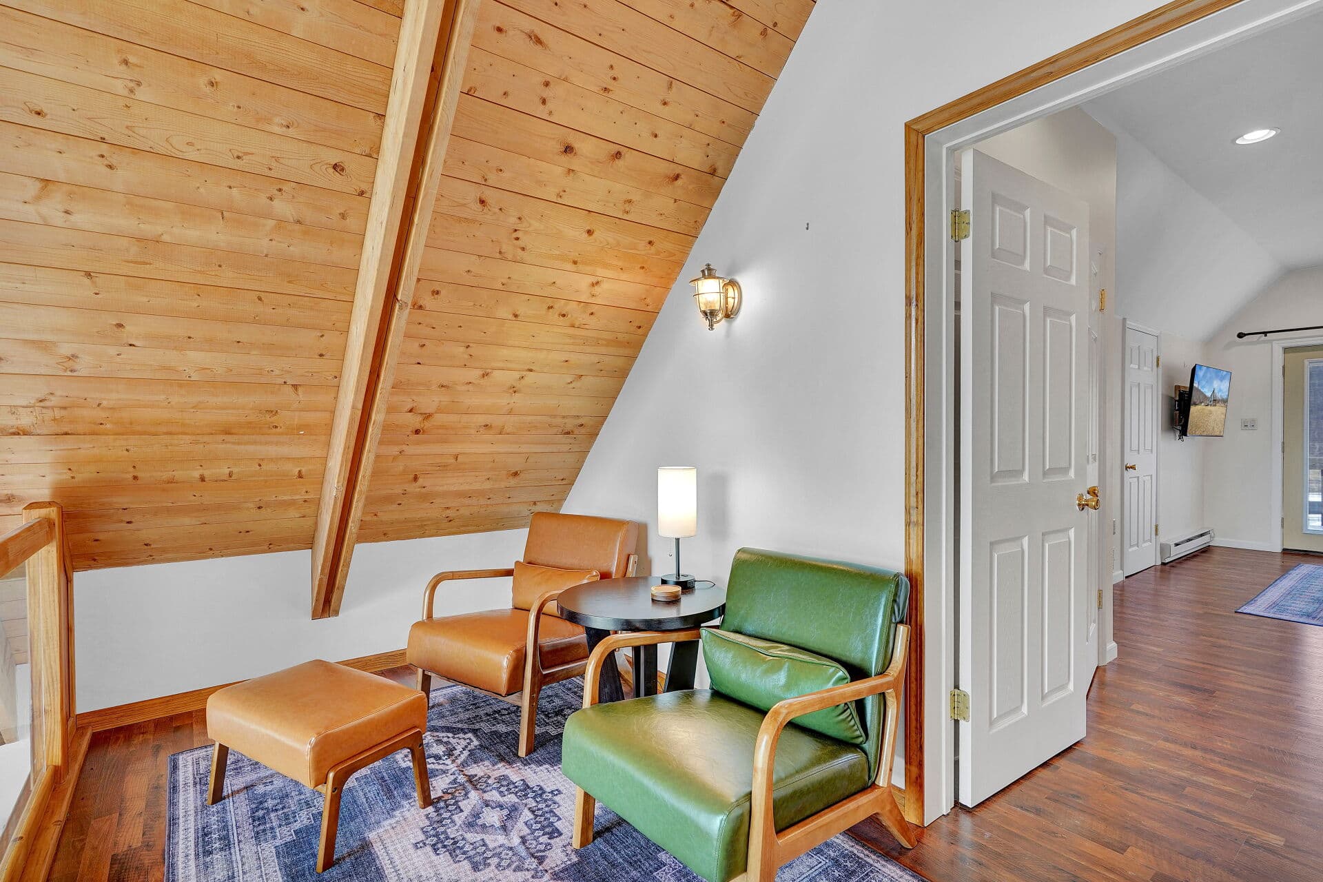 Entryway seating beneath vaulted wood ceilings