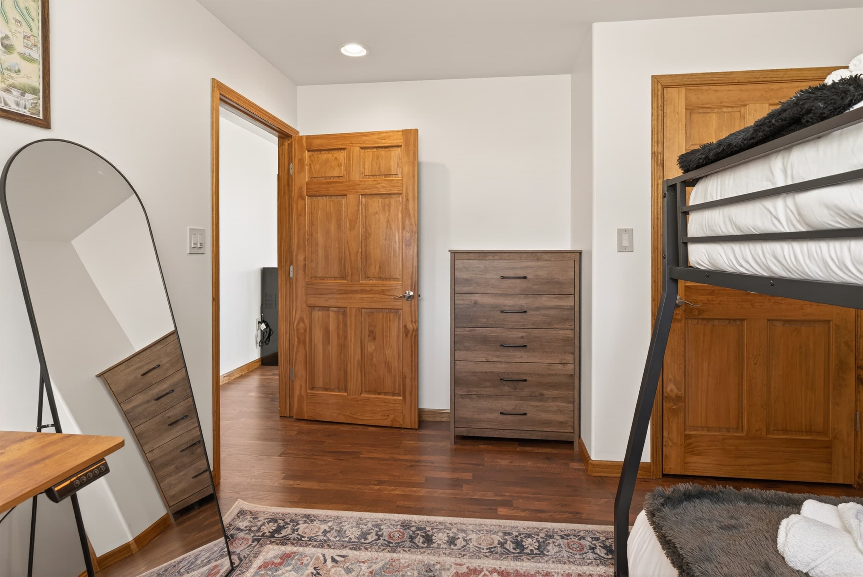 Bedroom with bunk beds and wood furnishings