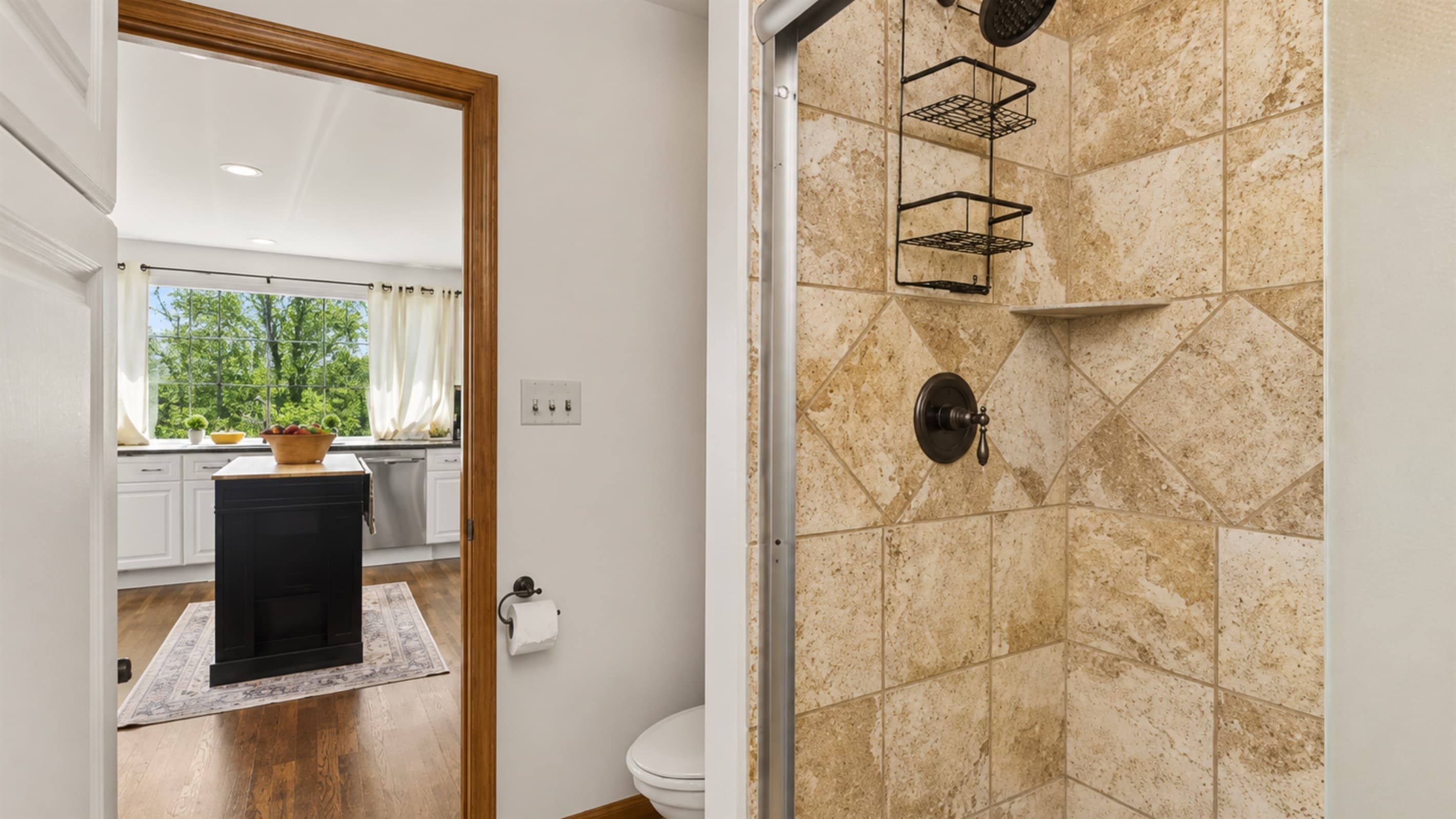 Bathroom vanity beside the tiled shower