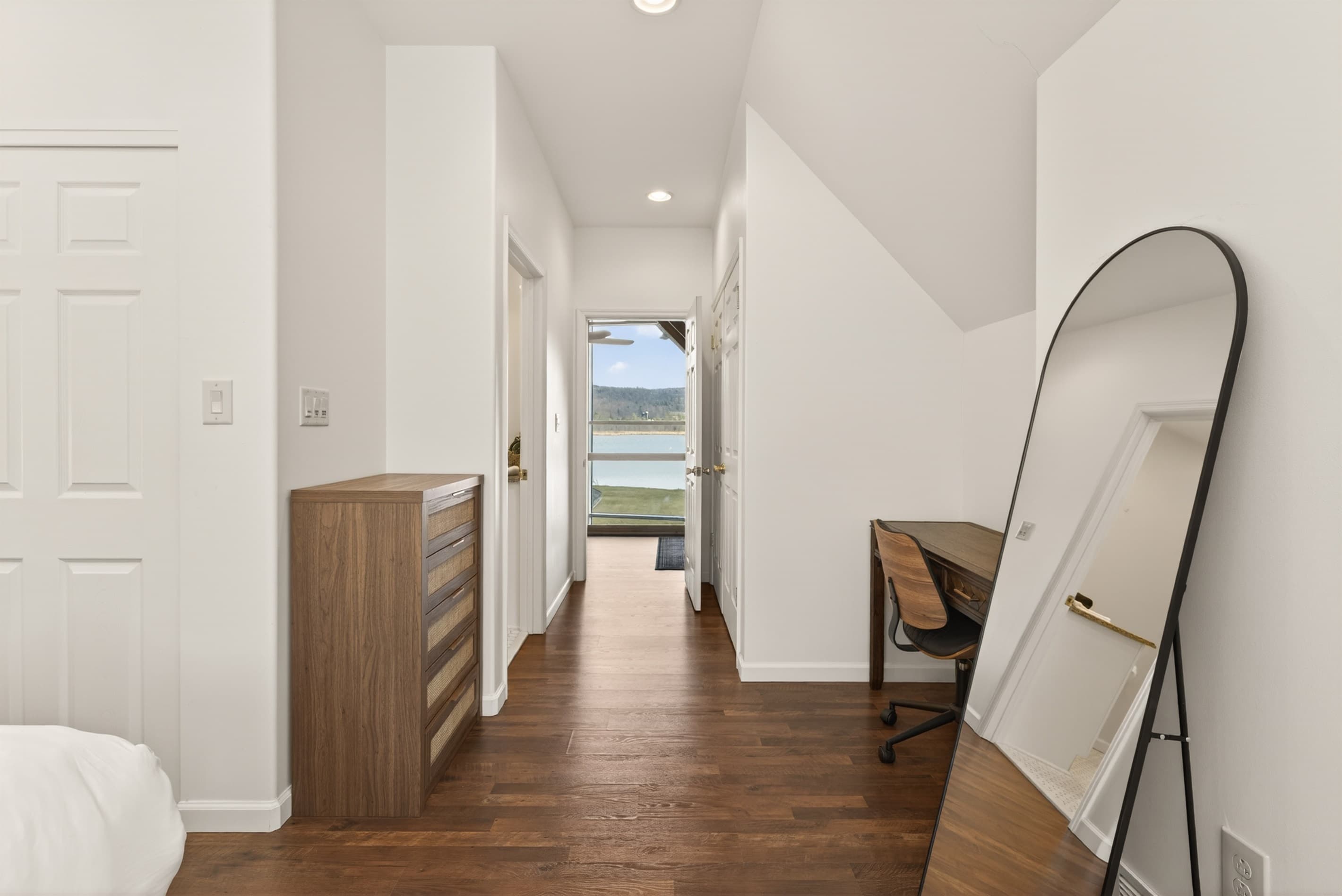 Interior hallway connecting bedrooms and bathroom