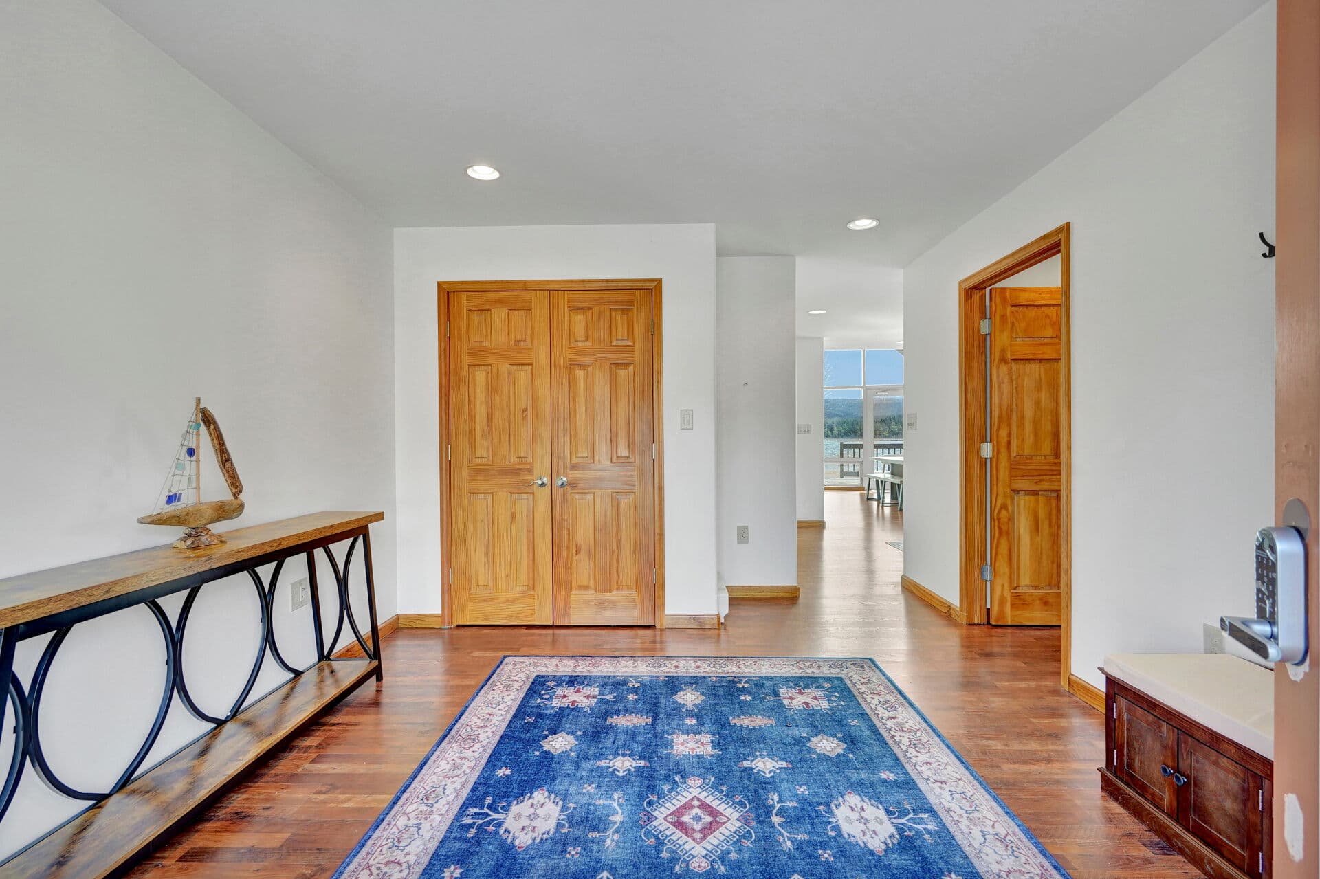 Bedroom with hardwood floors and wood closets