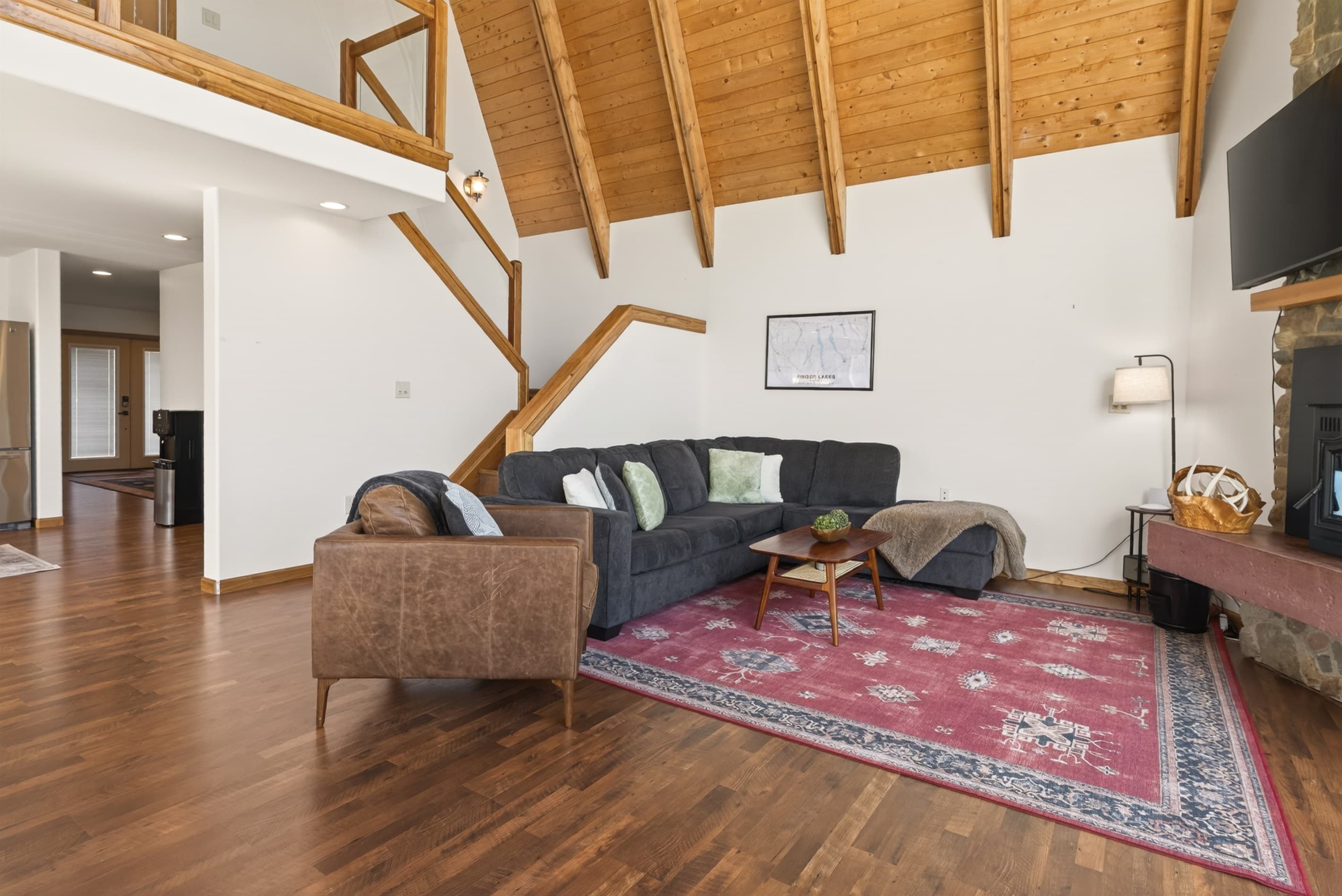 Living room arranged around a central rug
