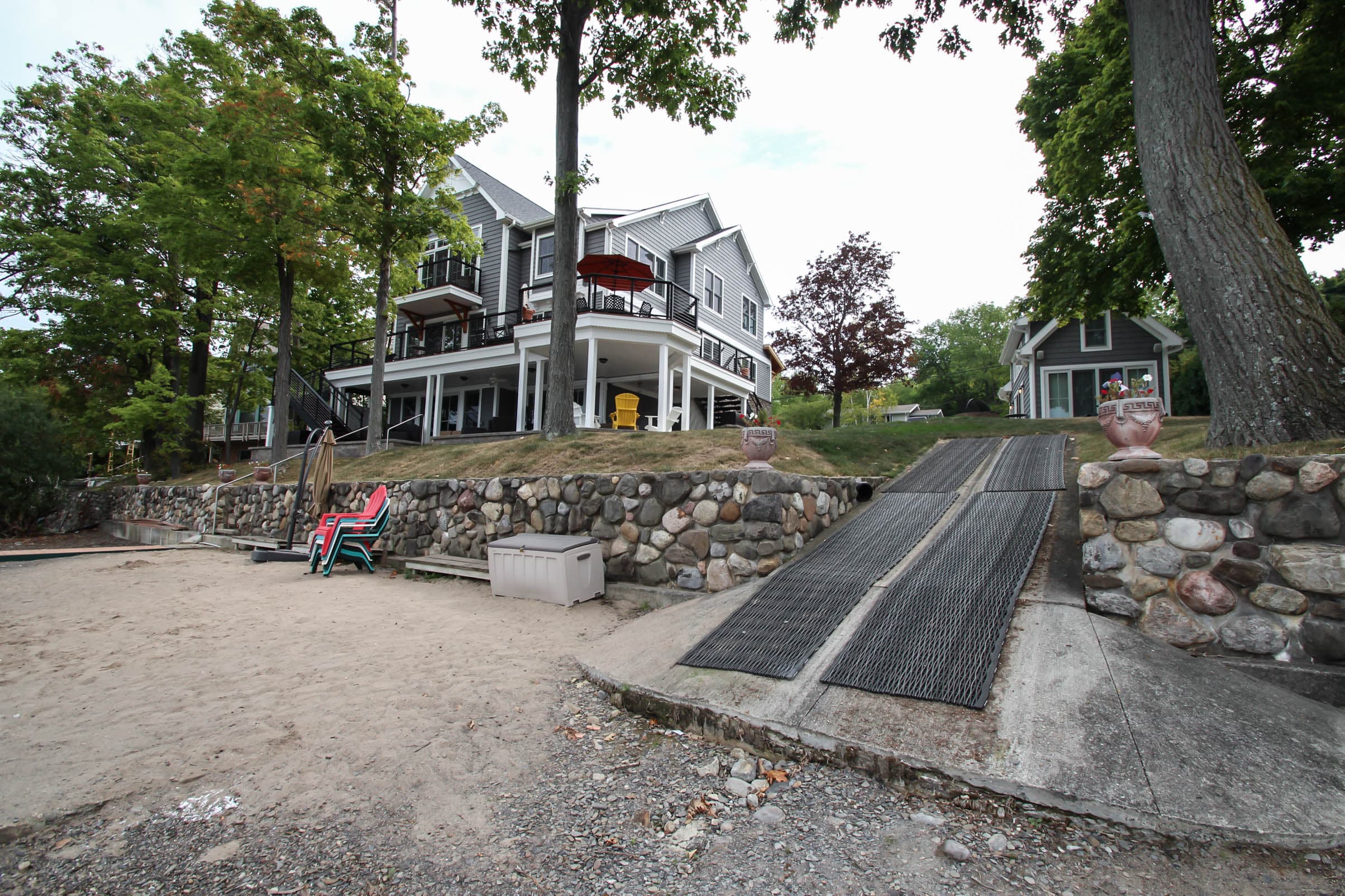 Sandy beach beside stone retaining walls