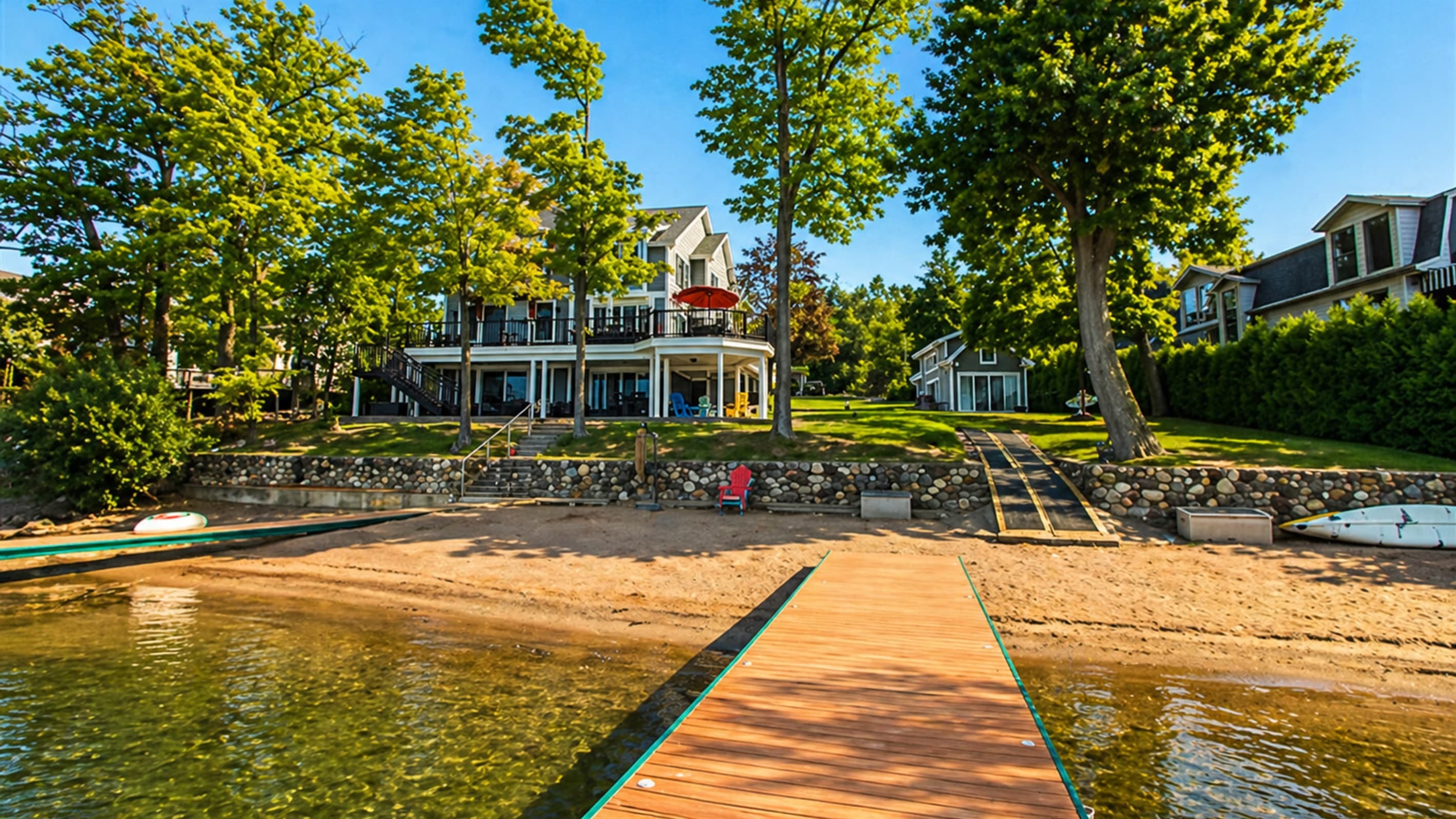 Sandy shoreline beside the lake-facing house
