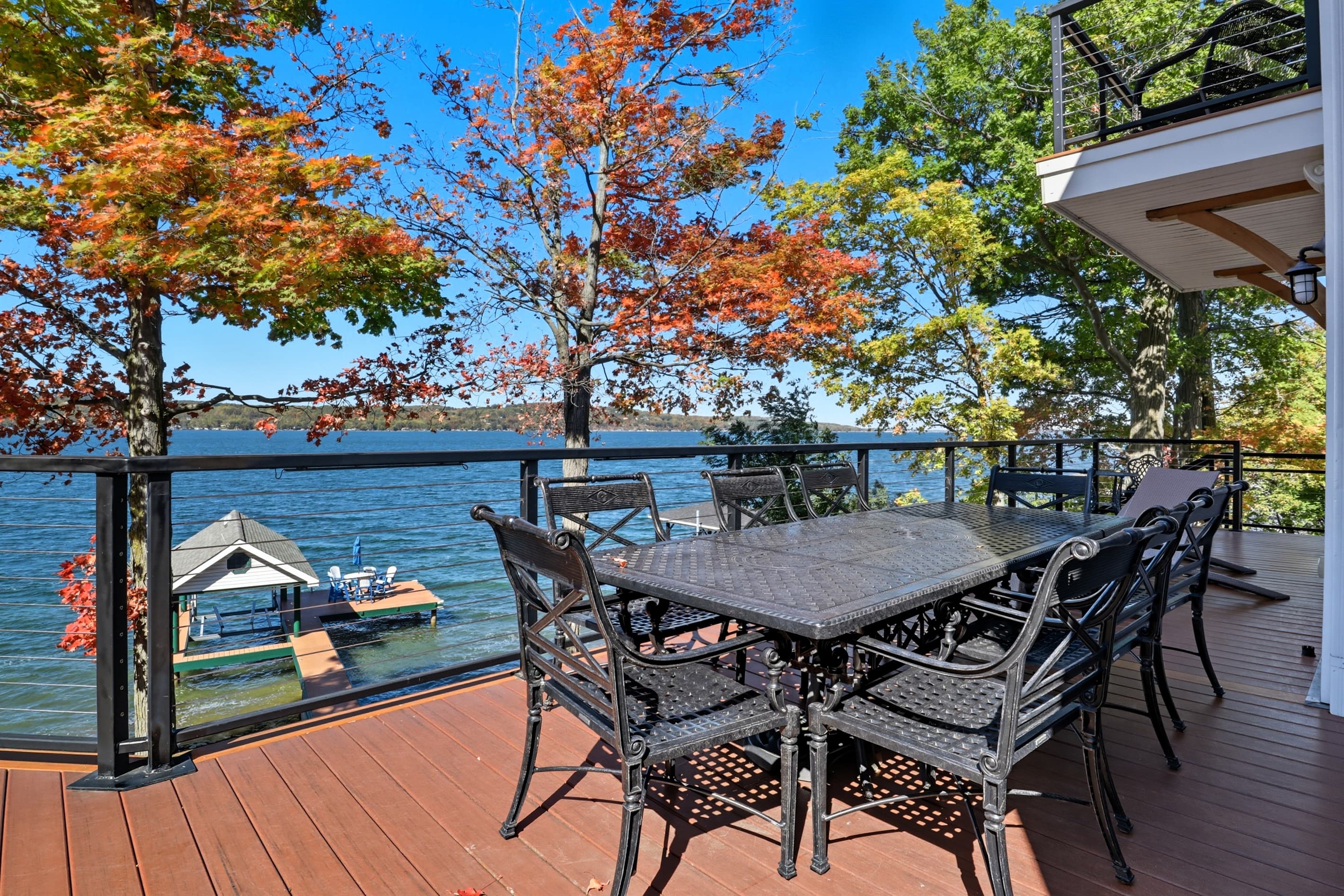 Outdoor dining set beneath autumn trees