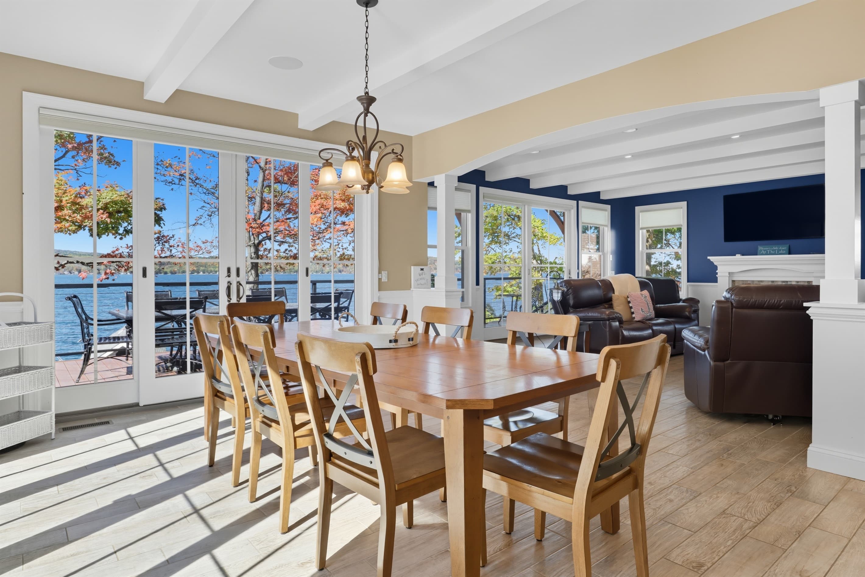 Dining area surrounded by lake-facing windows