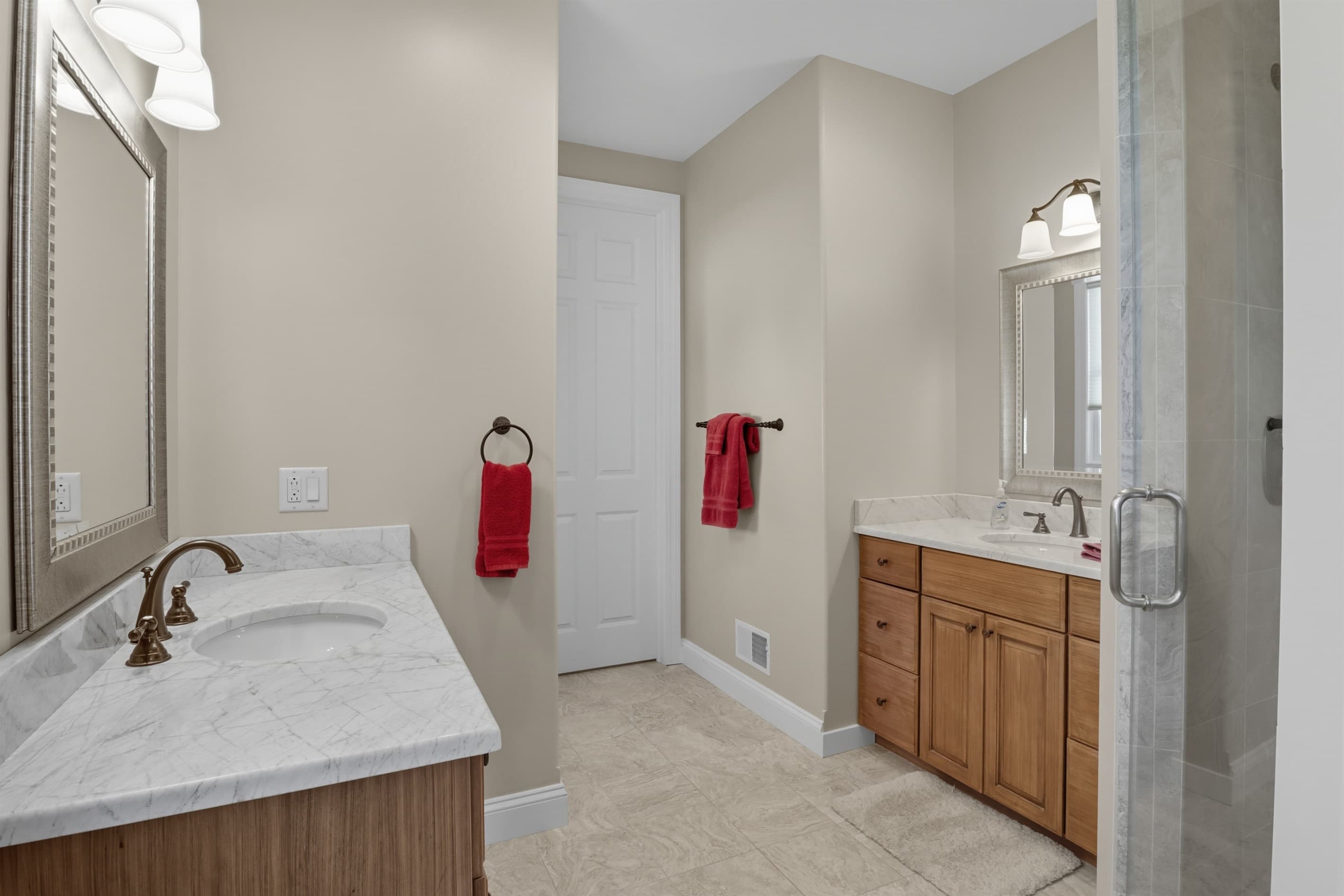 Bathroom with vanity, toilet, and glass shower