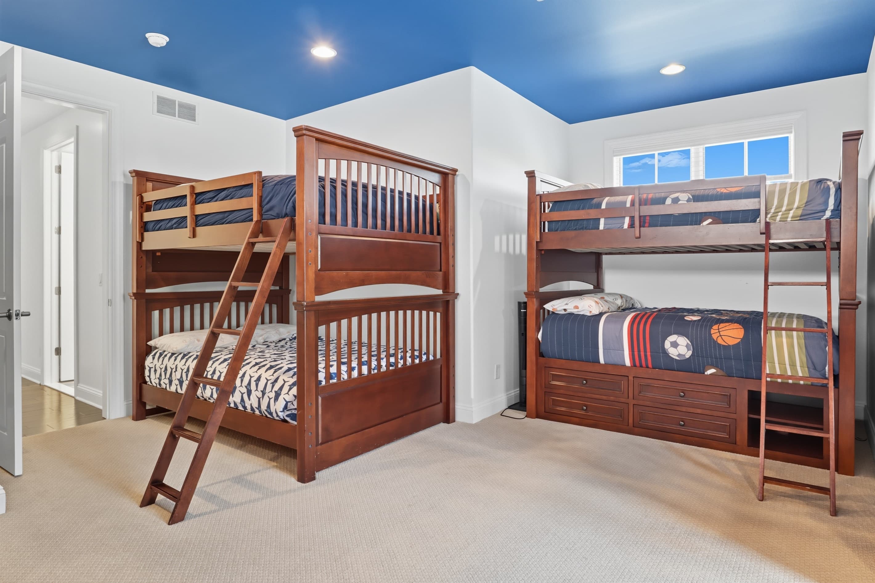 Bunk room with three wooden bunk beds