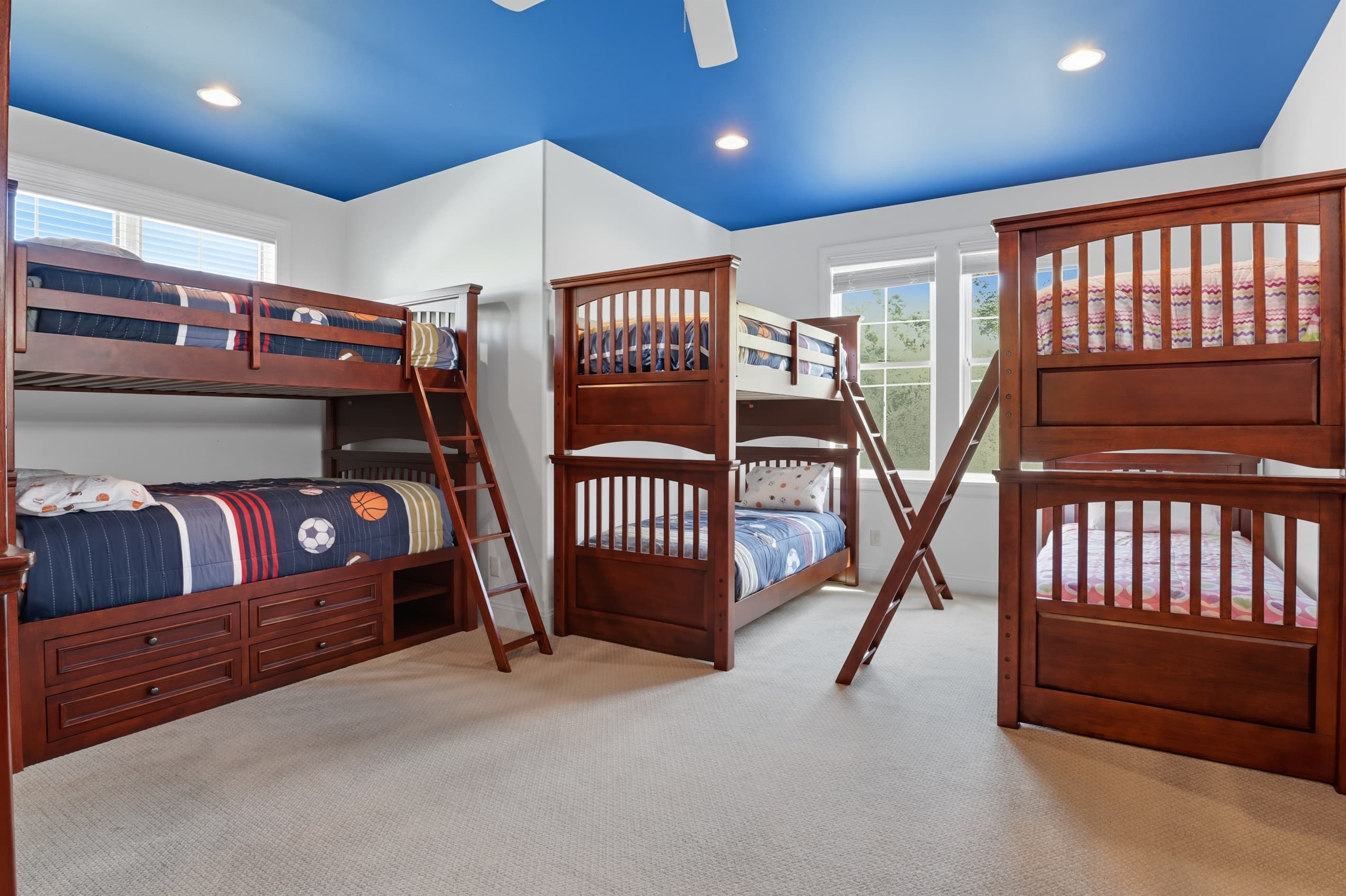 Bunk beds beneath blue ceiling