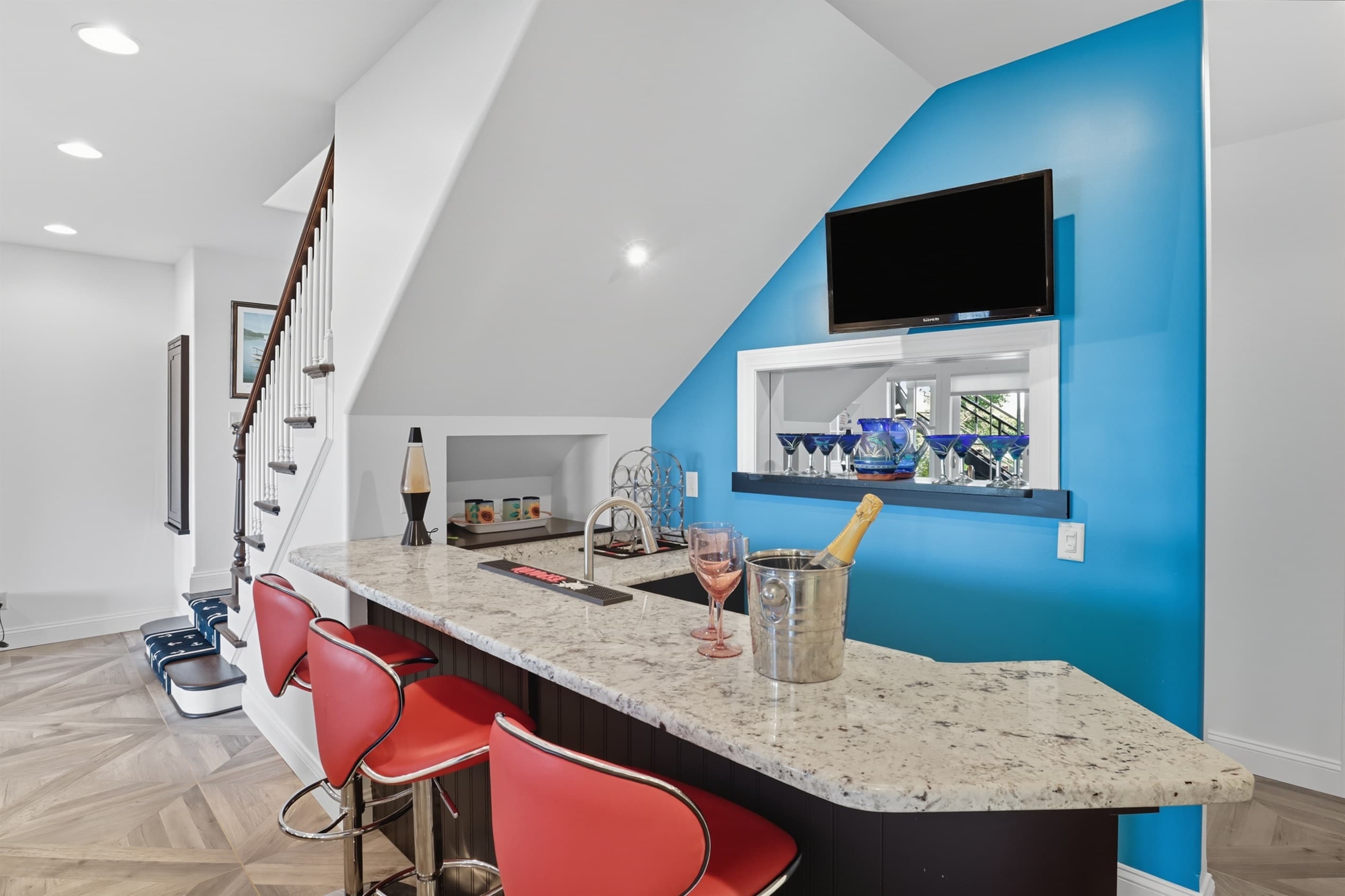 Blue wet bar with countertop seating