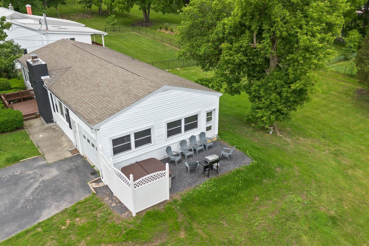 Single-story exterior surrounded by lawn