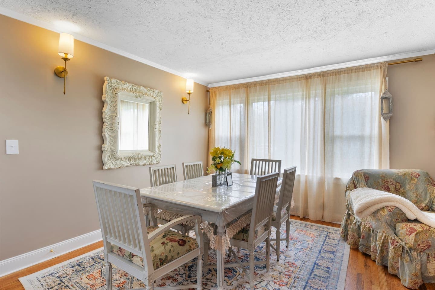 Dining table beside windowed sitting area