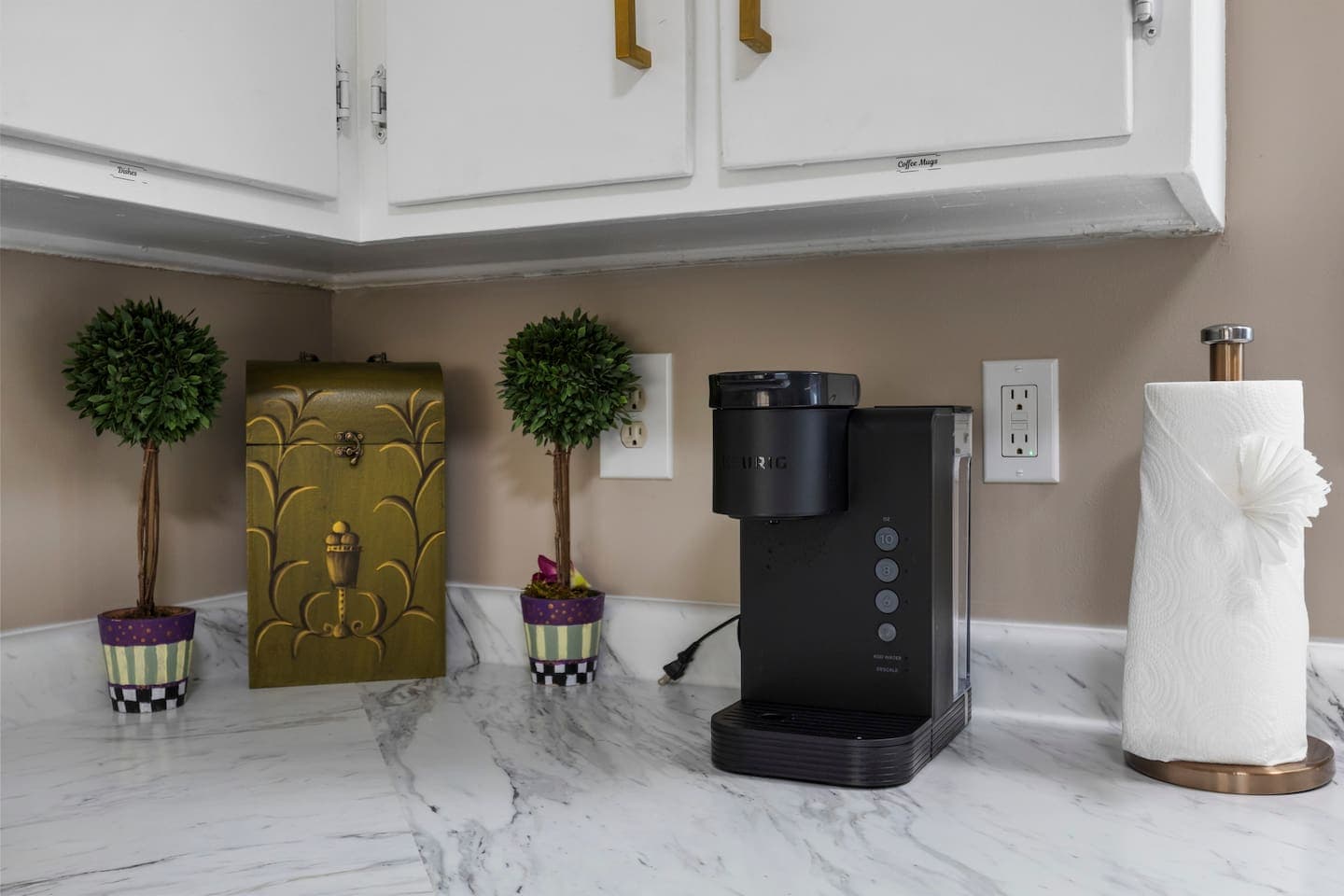 Beverage station with storage cabinet and plant decor