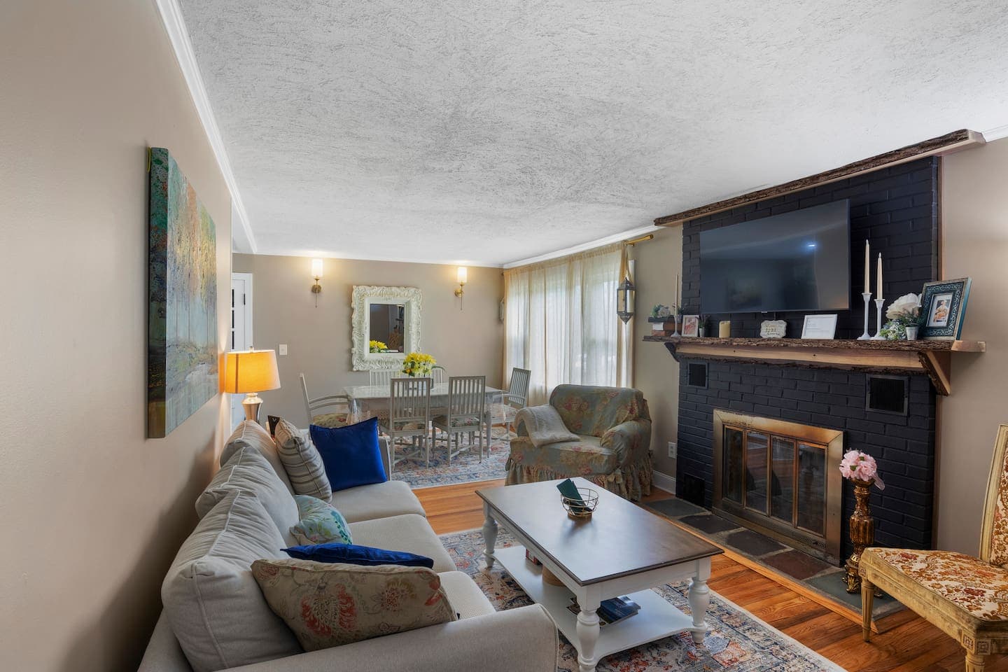 Living room with television and fireplace