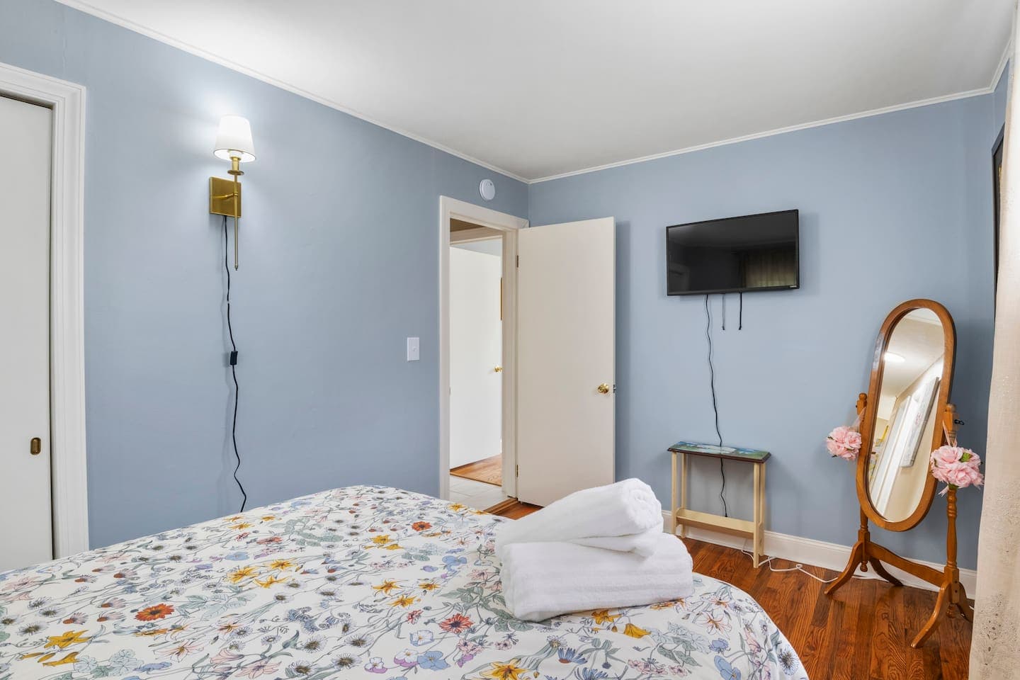 Bedroom television above wooden console